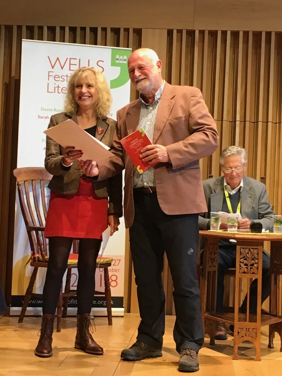 Rosie receiving her prize from Professor Terry Gifford at Wells, October 2018
