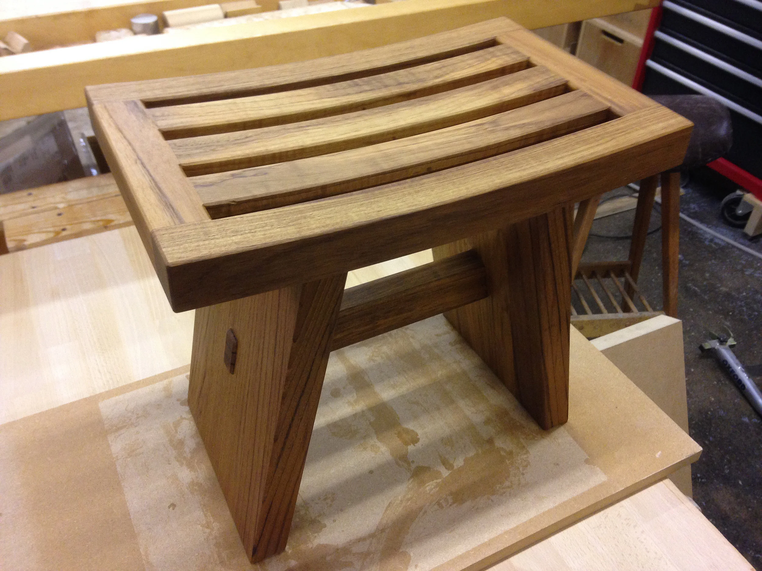 Solid teak Japanese inspired stool for a wet-room