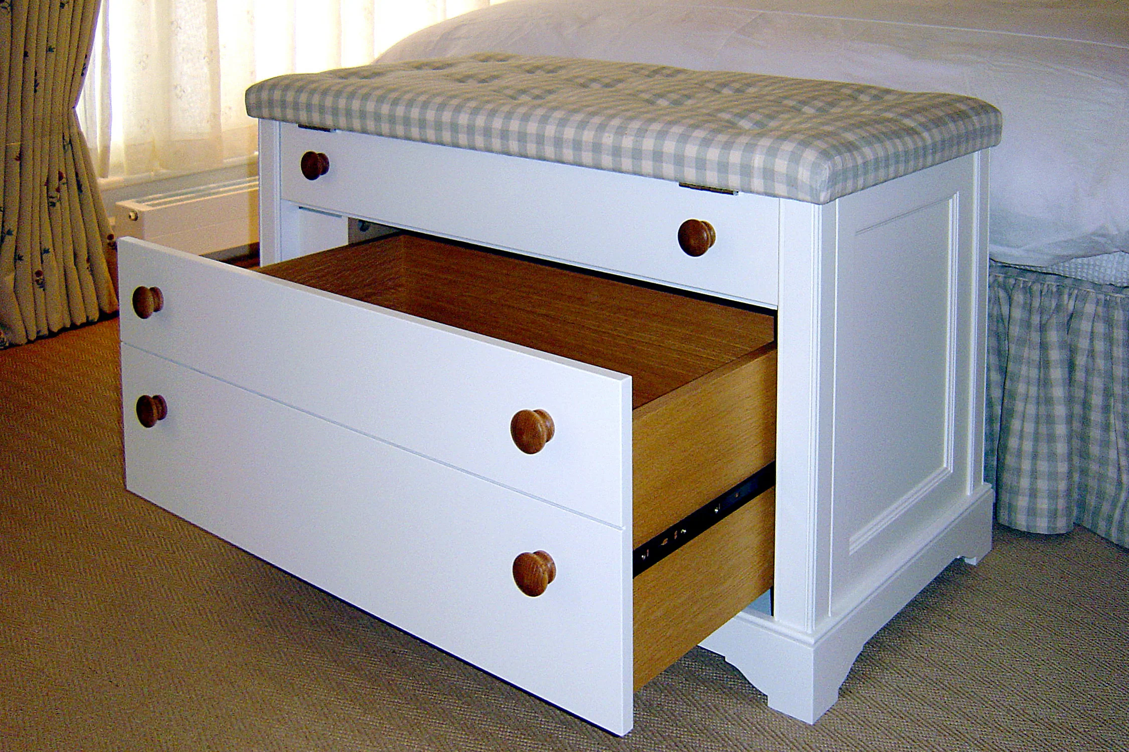 End of bed chest with with integral drawer, upholstered top and remote controlled TV lift
