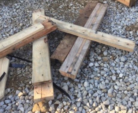 Boards with nails facing upwards