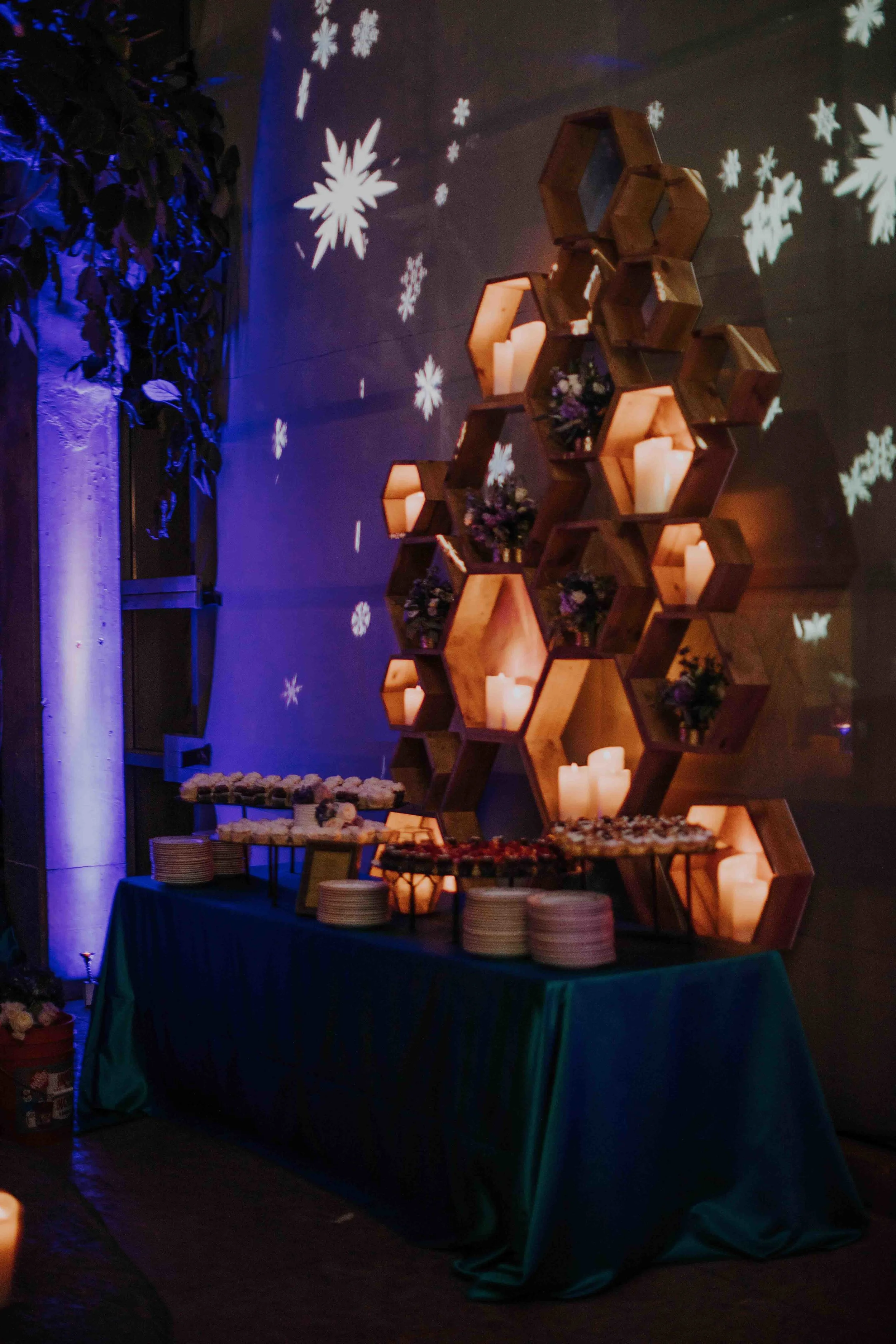 Custom honeycomb backdrop dessert display at wedding reception