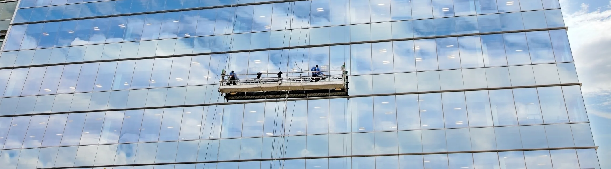 Exterior Caulking on Swing Stage
