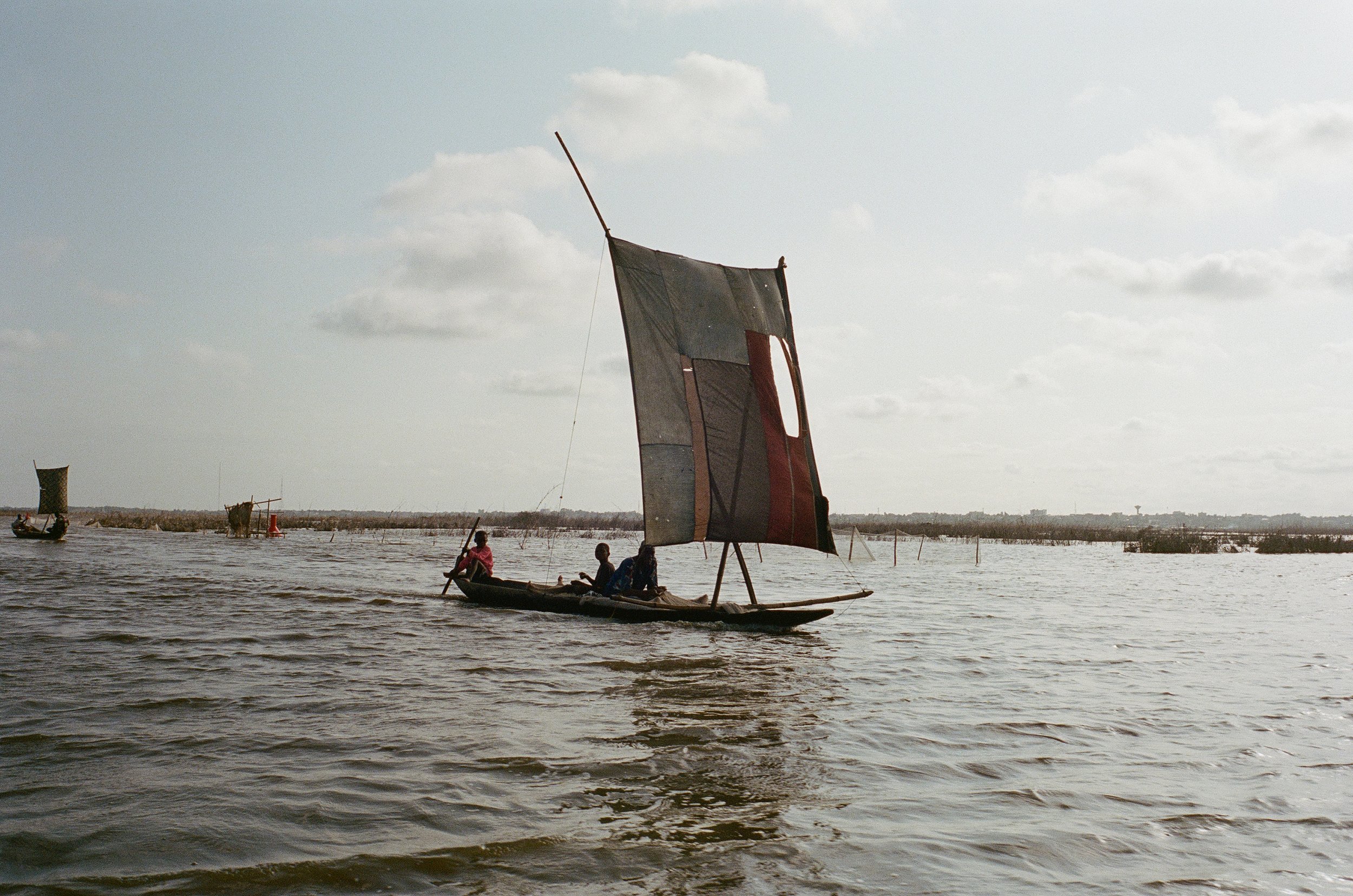  Youths on a sailboat.  