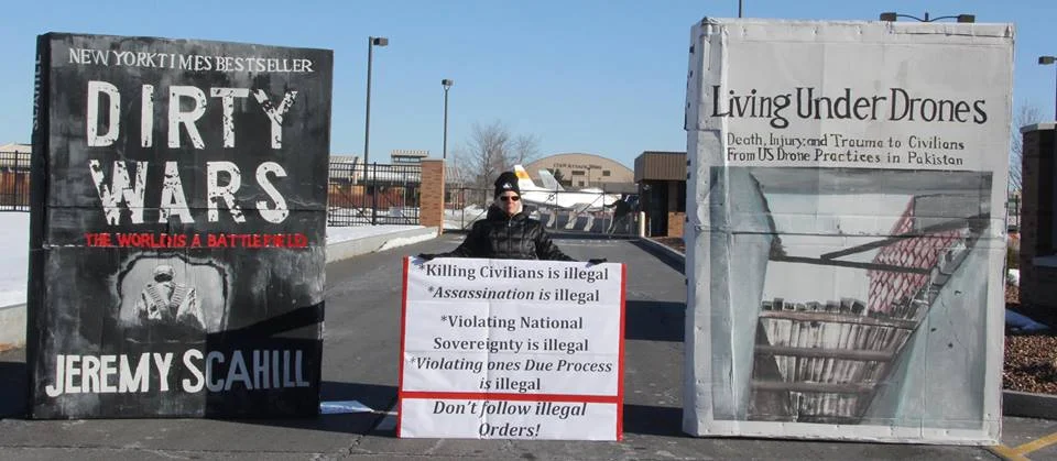 Bev Rice at the March 19, 2015 “Big Books” anti-drone war protest at Hancock Air Base outside Syracuse, NY.