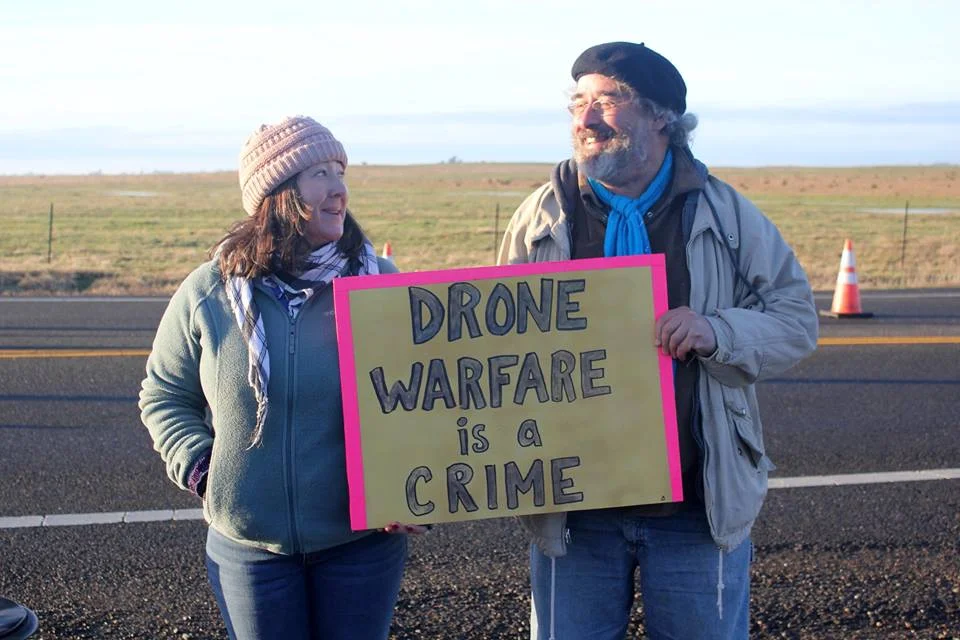 Flora Rogers and Brian Terrell at the entrance to Beale AFB’s main gate.