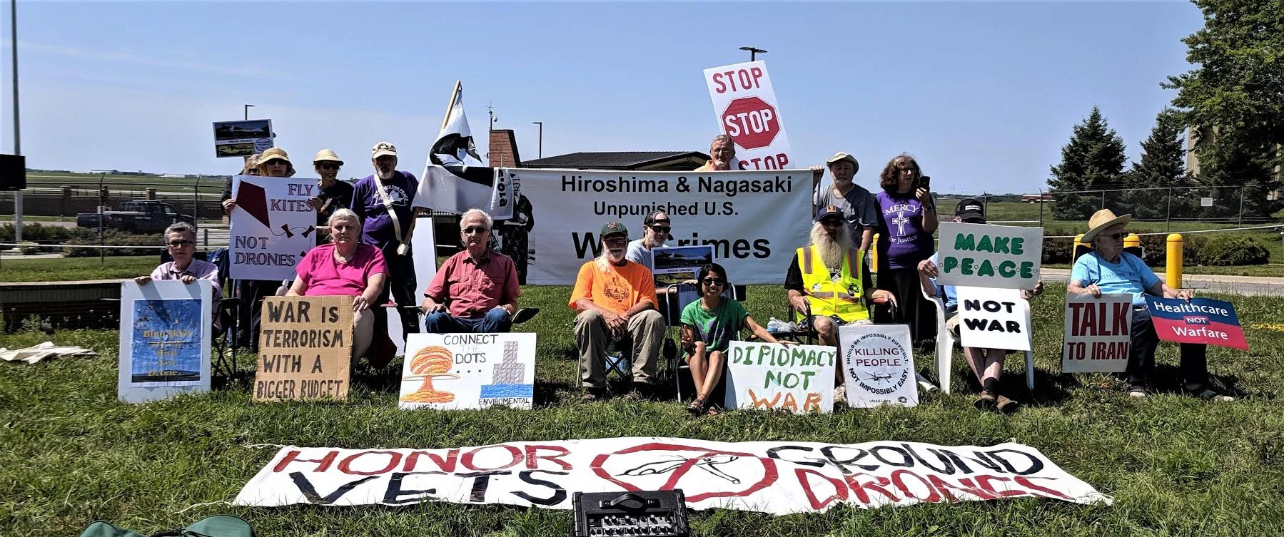 Members of the Des Moines Catholic Worker, Veterans for Peace and others protesting nuclear and drone war at the Des Moines Iowa Air National Guard base on August 9, 2019.