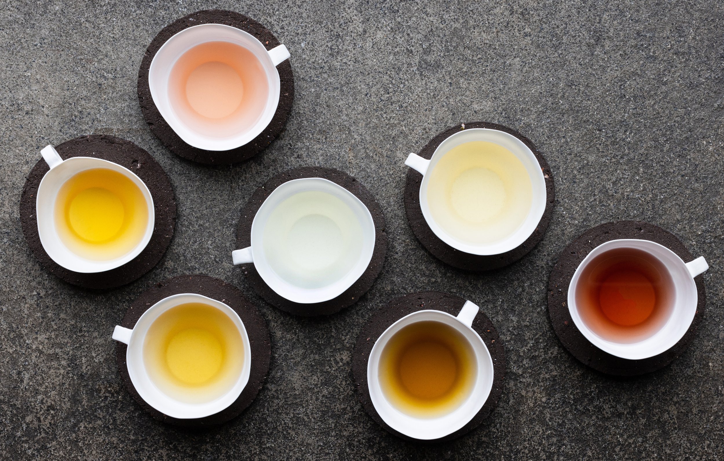 Grass-fed bone china teacups and farm soil saucers.