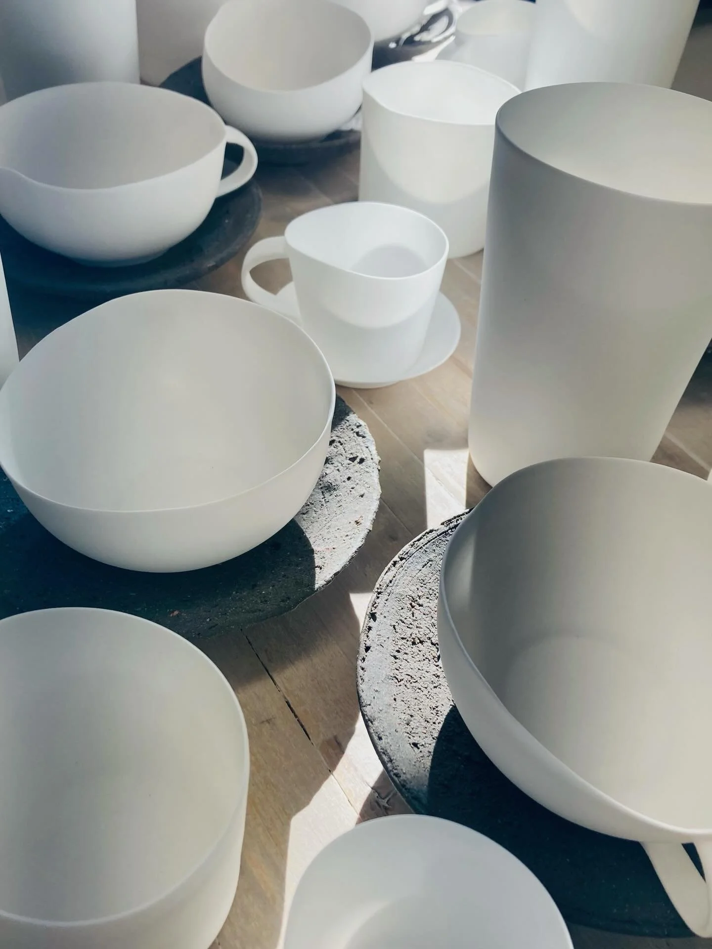 An expanding variety of bone china forms in studio light&mdash; water cup, tumbler, espresso cup and saucer, teacup and soil saucer

#bonechina #studio #light