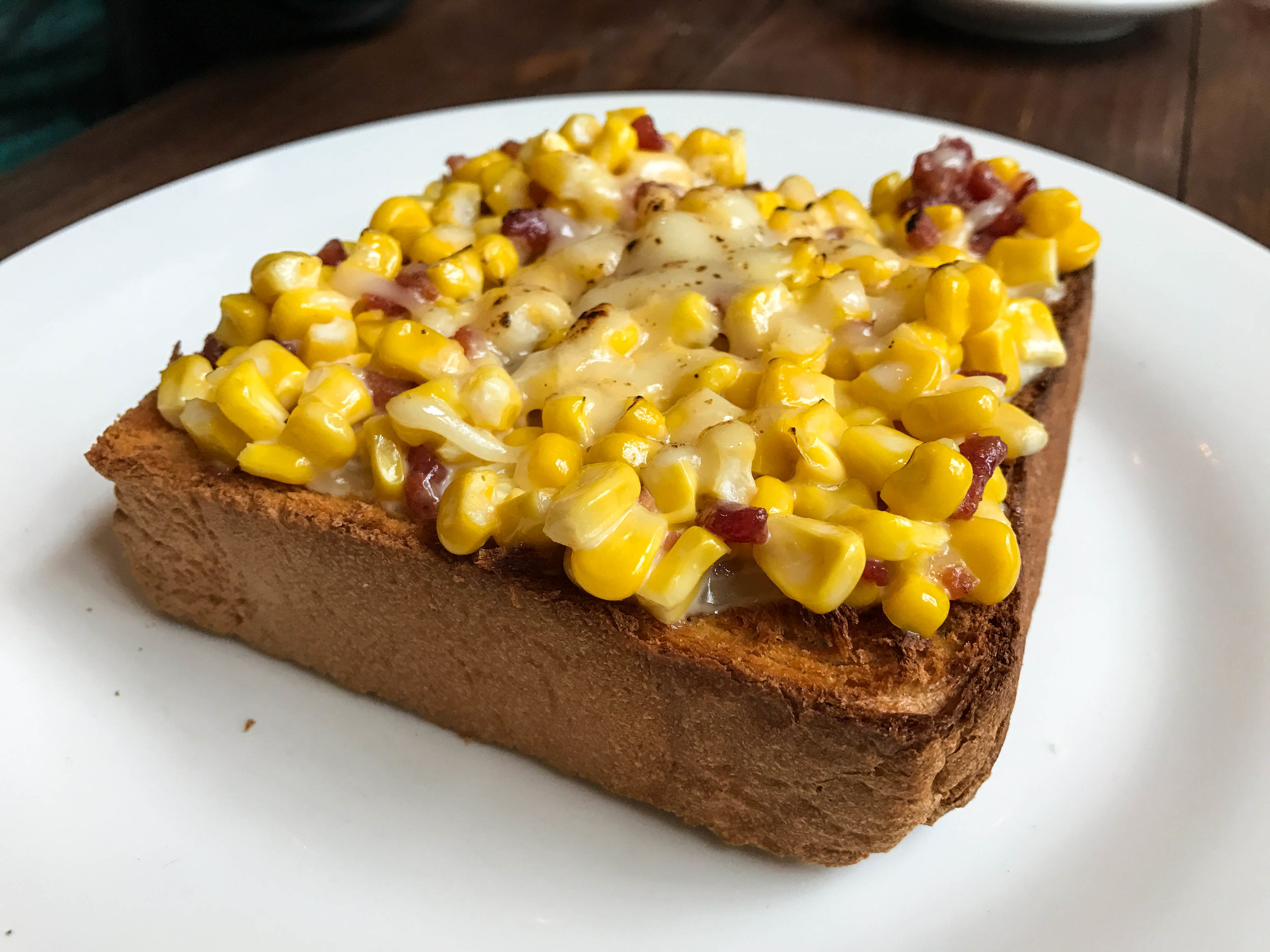 Creamed corn, bacon, and cheese toast
