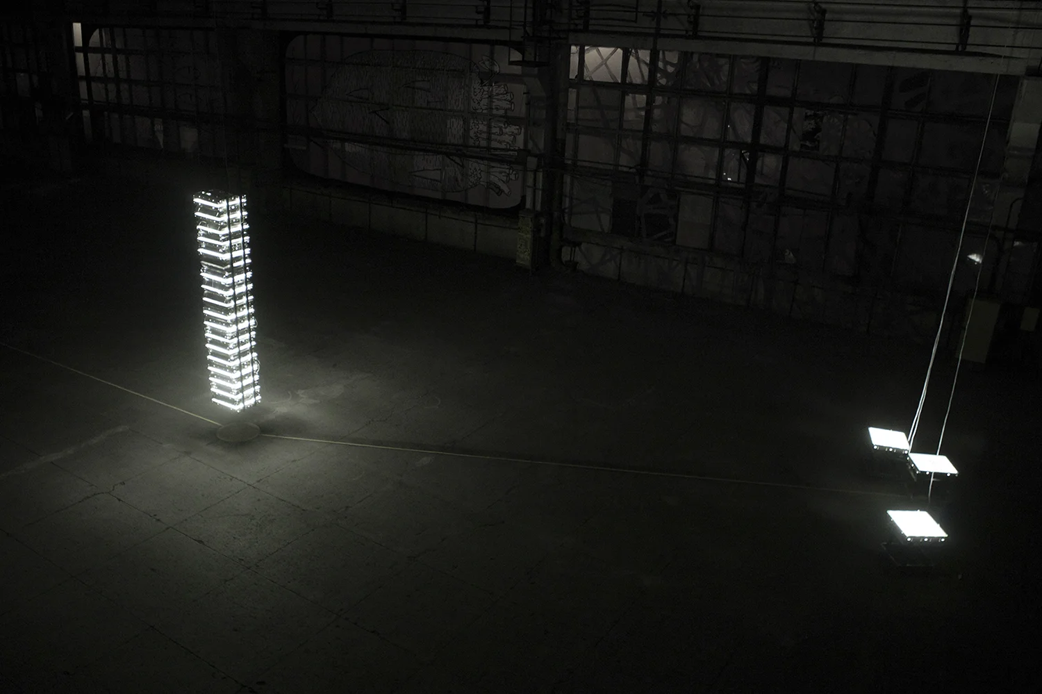 44 raster lamps, which lighten themselves, consuming about 3,5 kvt energy. The tower, consuming about 3,5 kvt energy, practically exists for itself. It would be hard to look at such amount of light, but as the object absorbs what it’s producing, there’s not much left for the outside world. Object that Inlights Itself 2014, installation. Raster lamps, wires, metal profile, dimensions variable