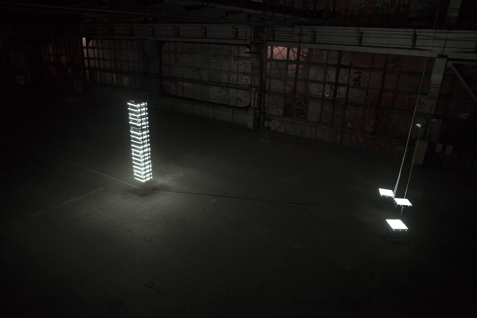  44 floating raster lamps that Inlight’s Itself - non od 4 kilowatts of light comes out.   Object that Inlight’s Itself   2013, installation. Raster lamps, wires, metal profile, dimensions variable 