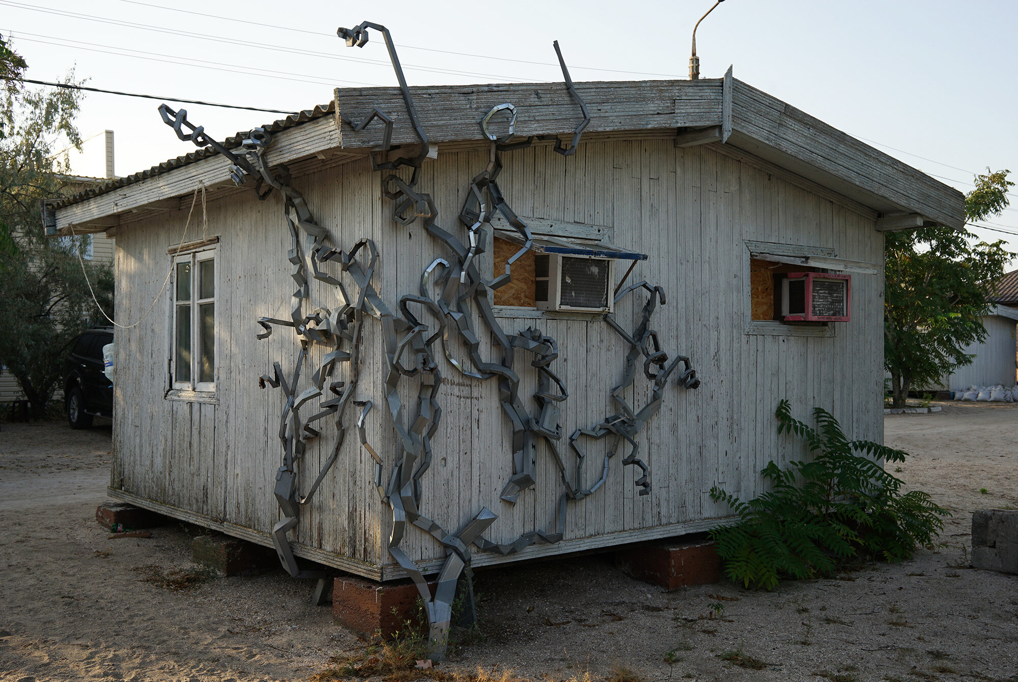  A parasite that lives on the tiny wooden house   Plant   2012, Installation, drywall stands.  