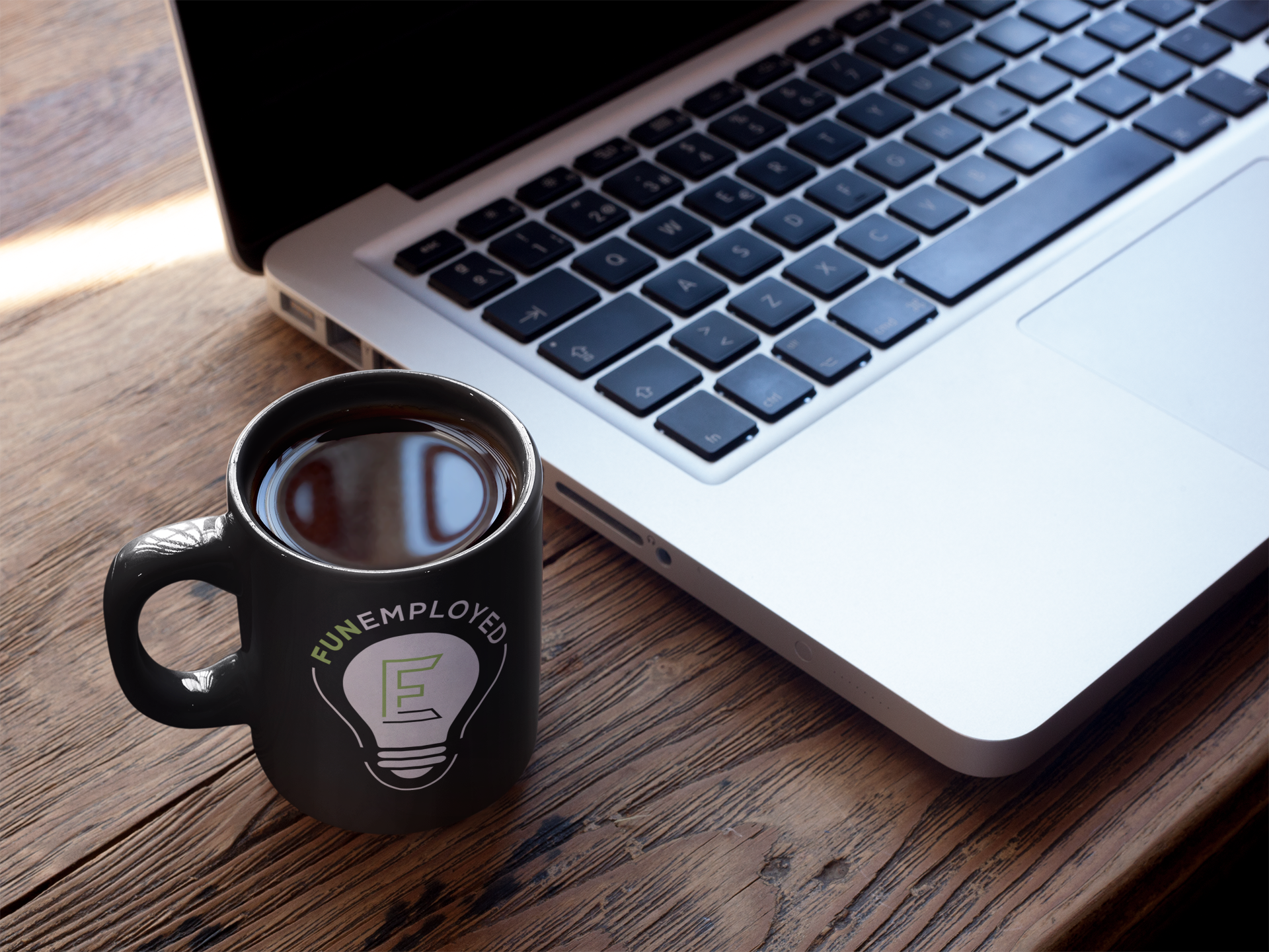 cup-of-coffee-mockup-near-a-macbook-a16461.png