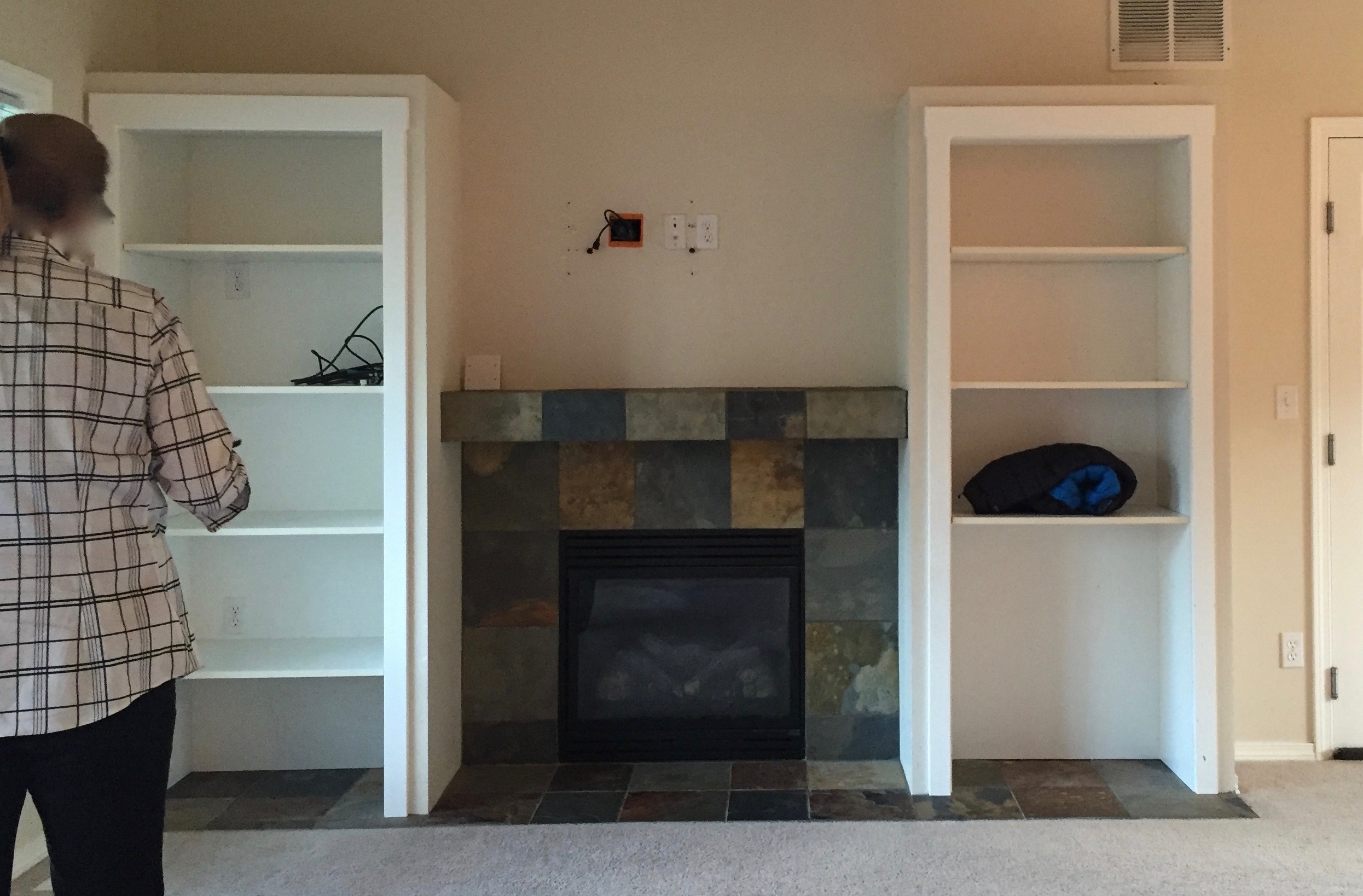 Before: Built-in shelves, old fireplace, old dirty carpet, yuck!