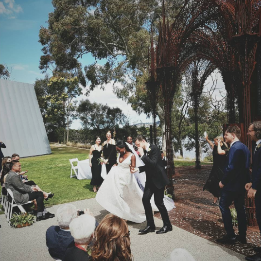 Bride and groom dancing out