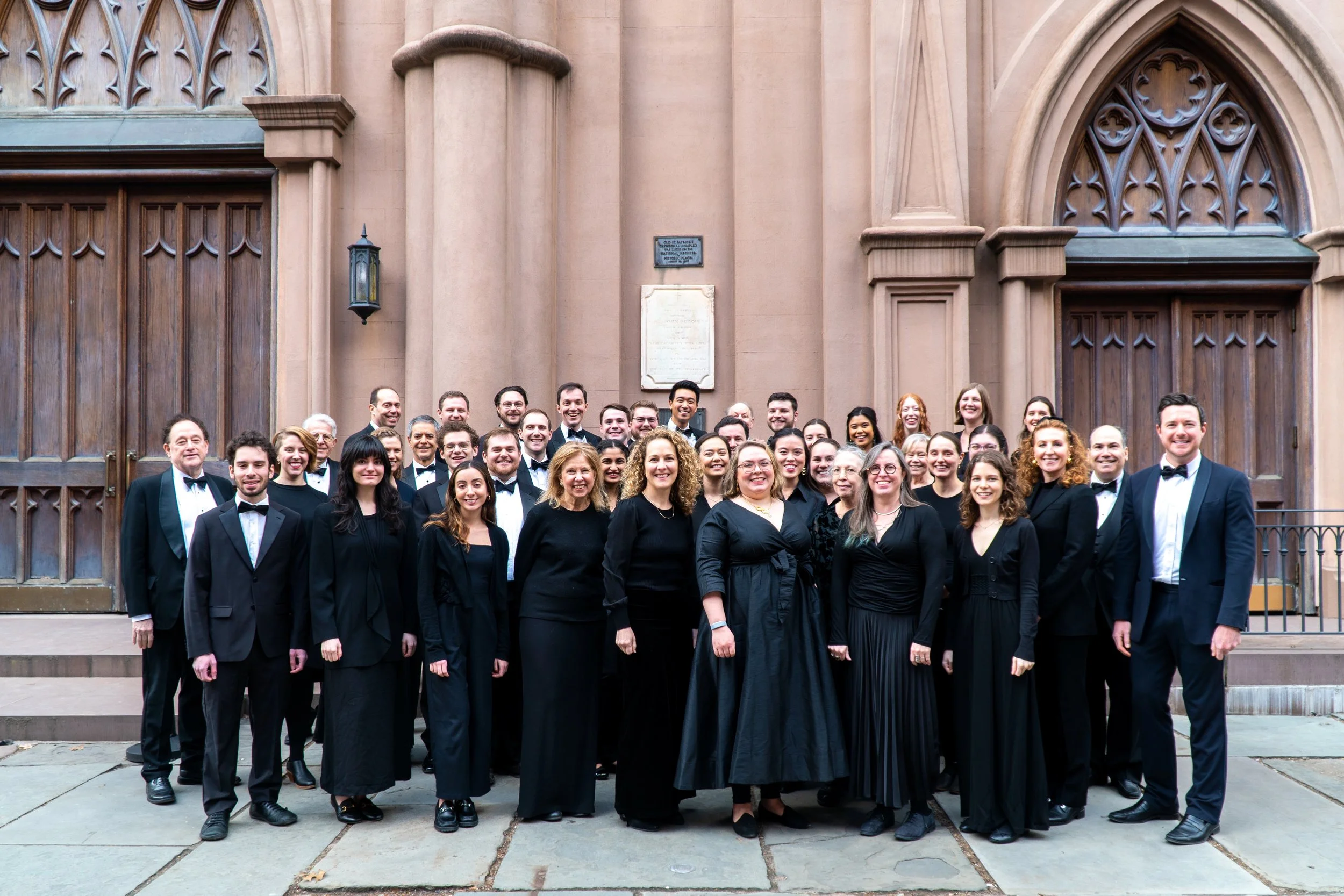 The full choir in concert attired, gathered outside the venue 