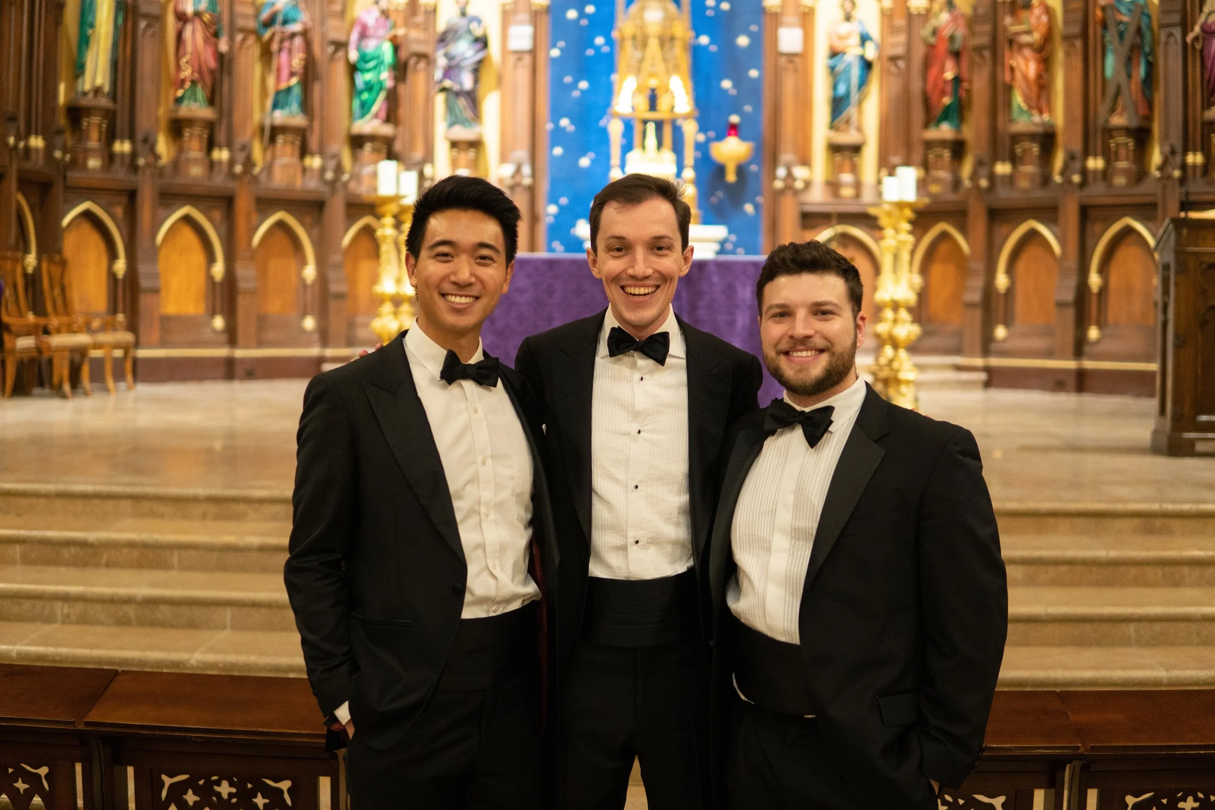  Three bases, in concert attire, inside the venue 