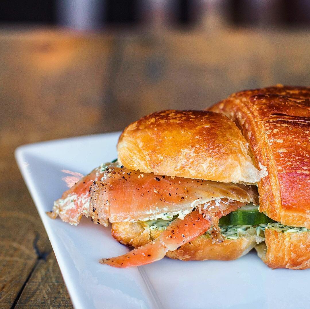 #Didyouknow we cure our salmon in house, and stuff it inside a fresh house-baked croissant that we smother with deli style dill cream cheese and capers? No? Whatcha doin' later? #allday #salmon #brekkie #lunch #croissant #creamcheese #sandwich #crois