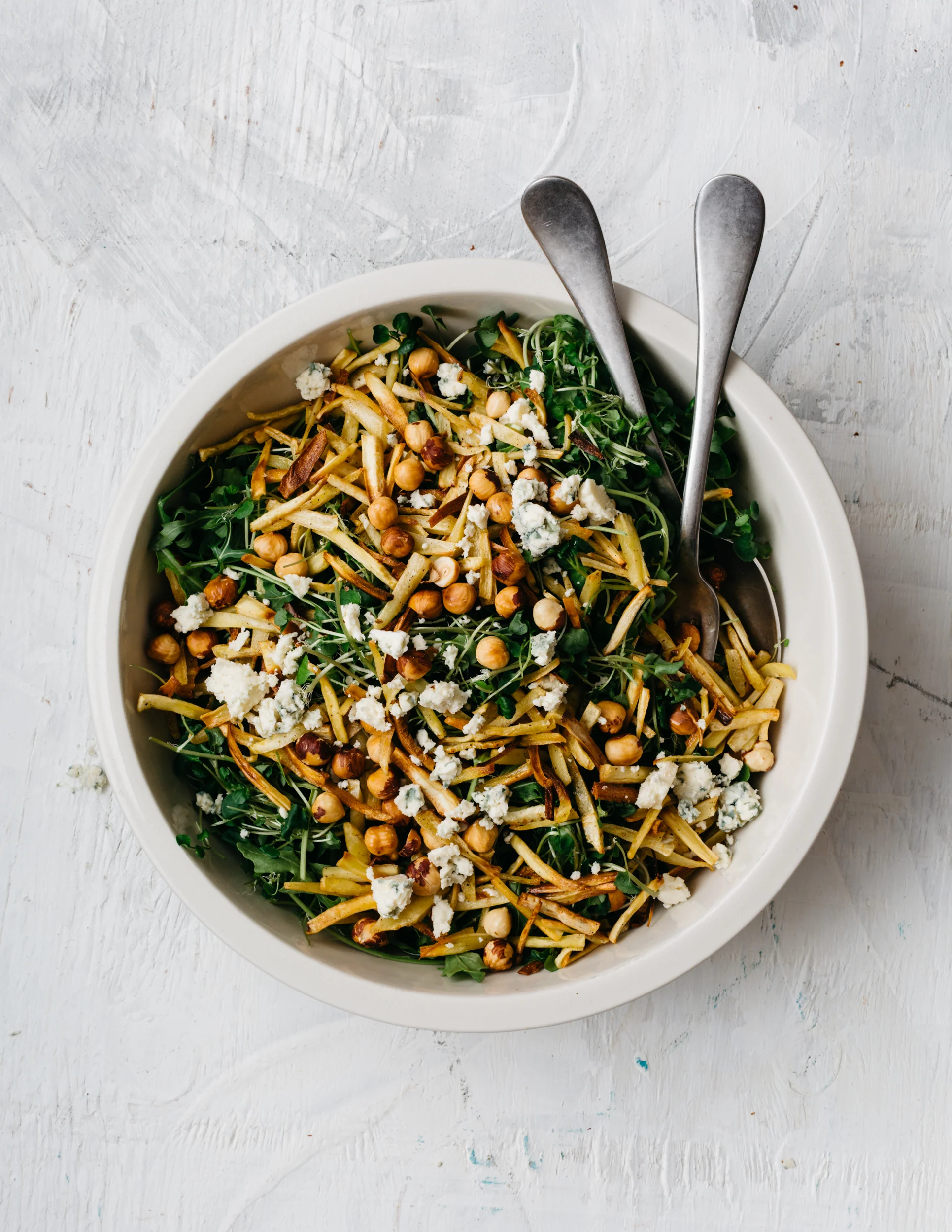 Roasted Spring-Dug Parsnip and Bitter Greens Salad with Blue Cheese and Hazelnuts