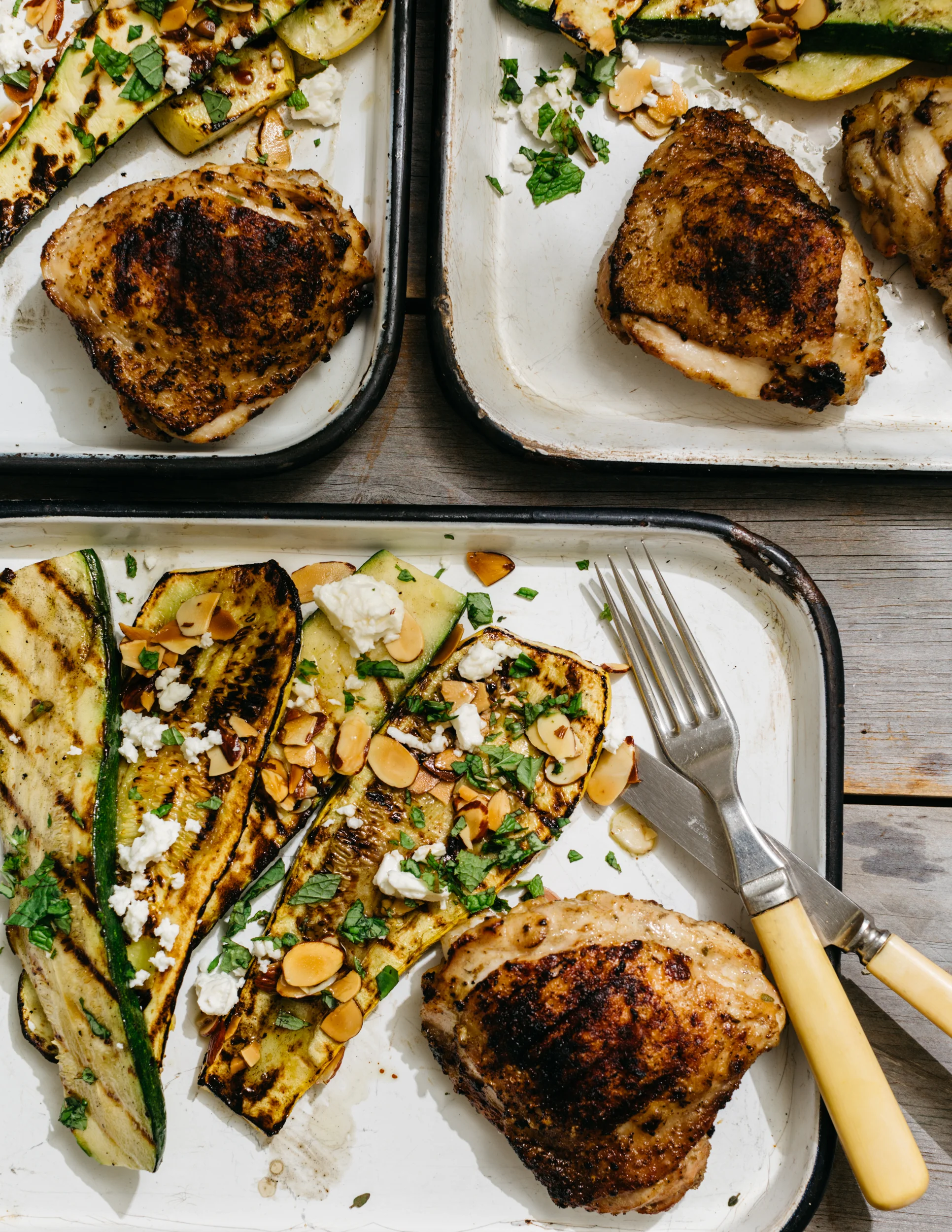 Deviled Chicken Thighs with Summer Squash-Zucchini Salad, Fried Almonds, Feta &amp; Herbs