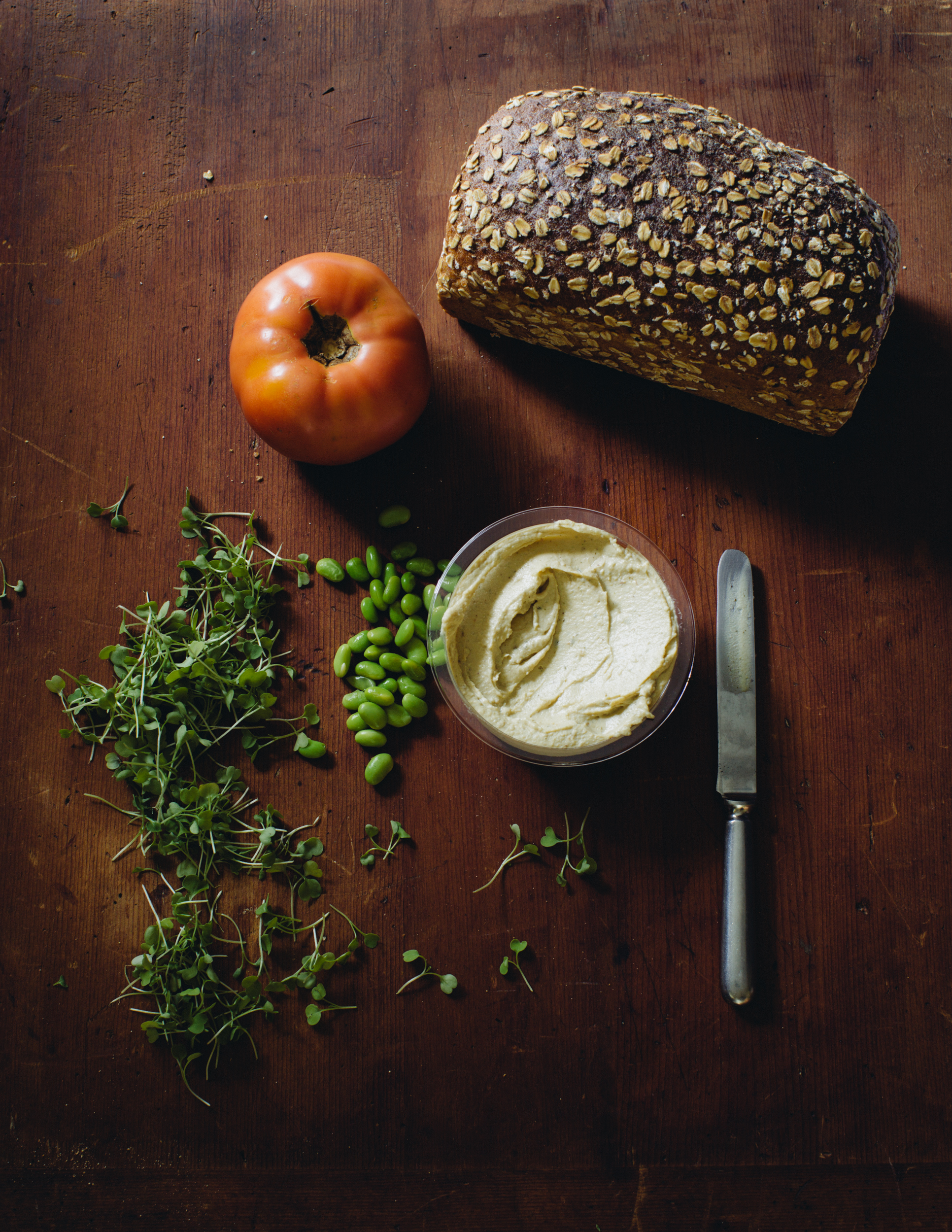 Edamame Hummus, Sprouts and Tomatoes on Toasted Sprouted Grain Raisin Bread