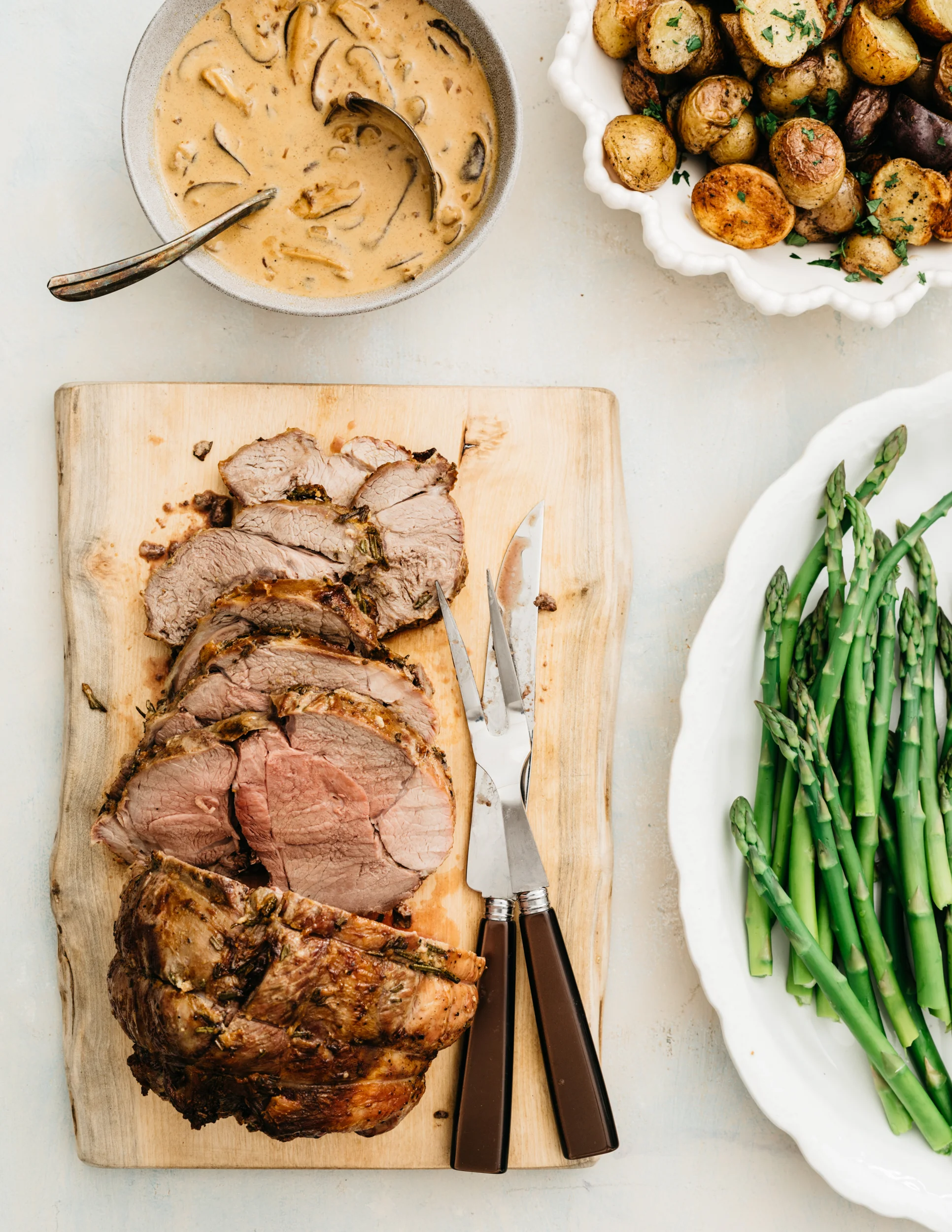 Roasted Boneless Leg of Lamb with Mushroom Cream Sauce
