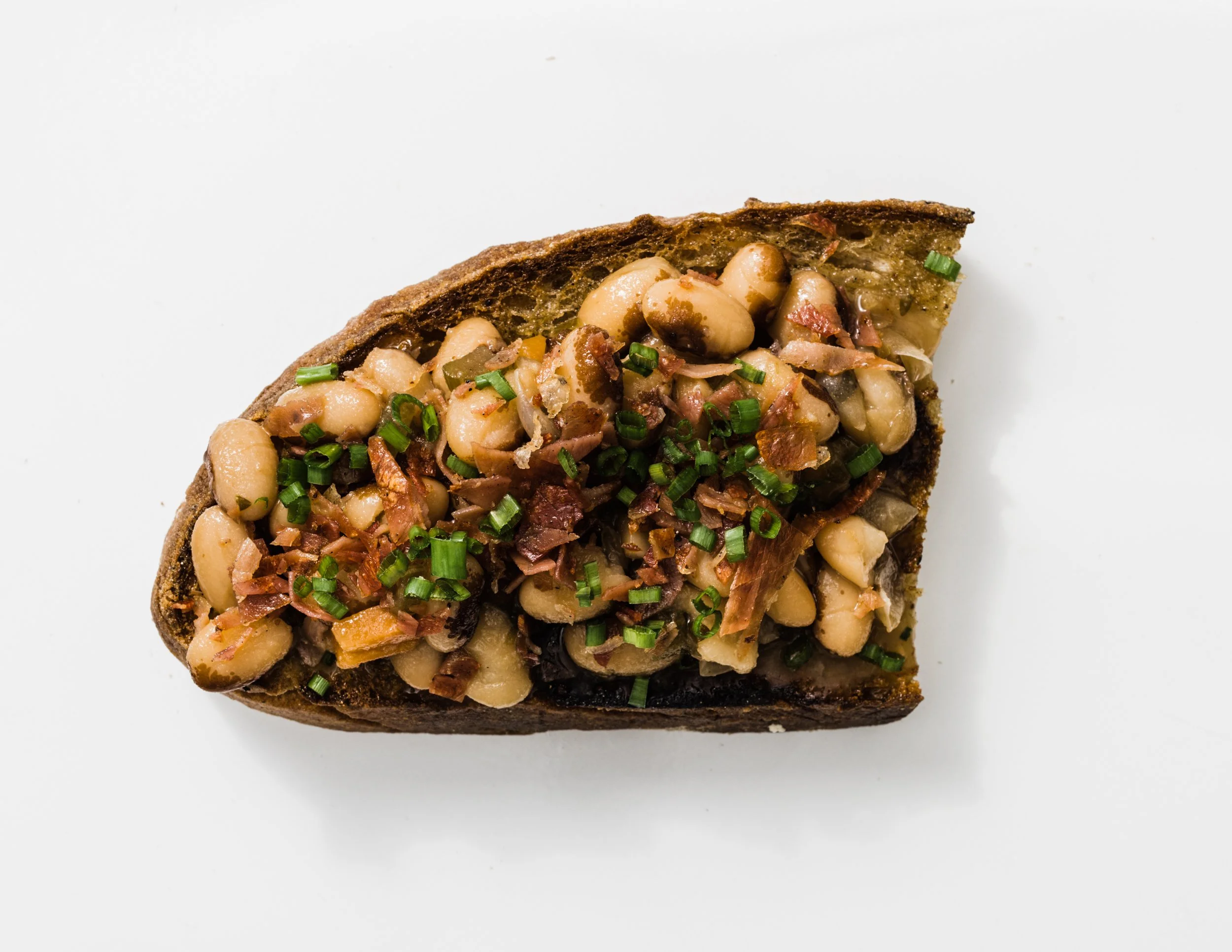 Beans on Toast with Crisped Cured Ham and Chives