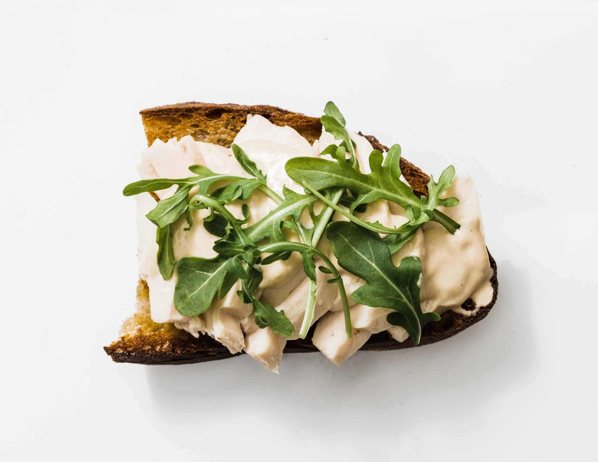 Poached Chicken on Toast with Tonnato Sauce and Arugula