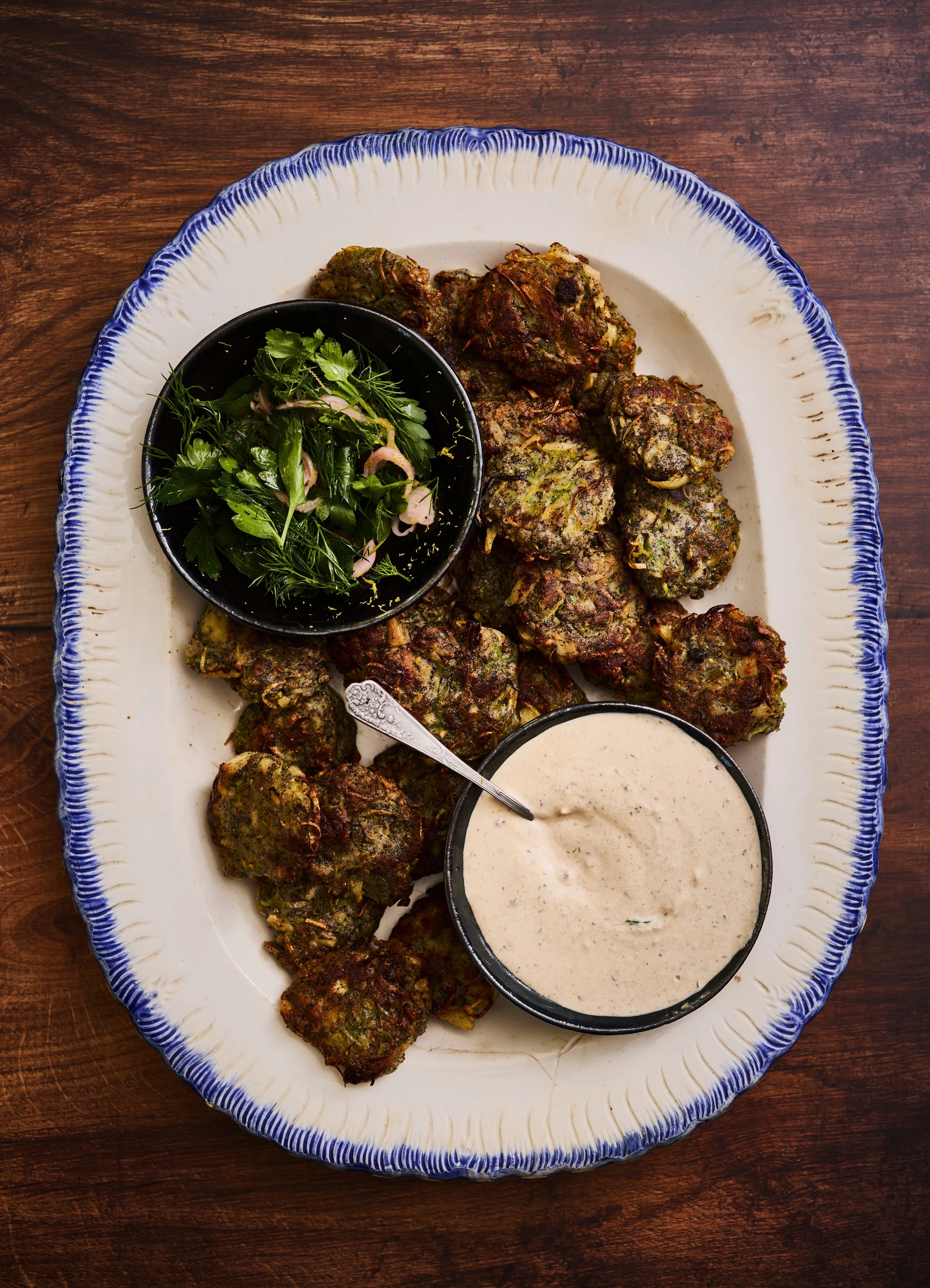 Spring-Dug Parsnip Fritters with Black Garlic Yogurt and Herb Salad