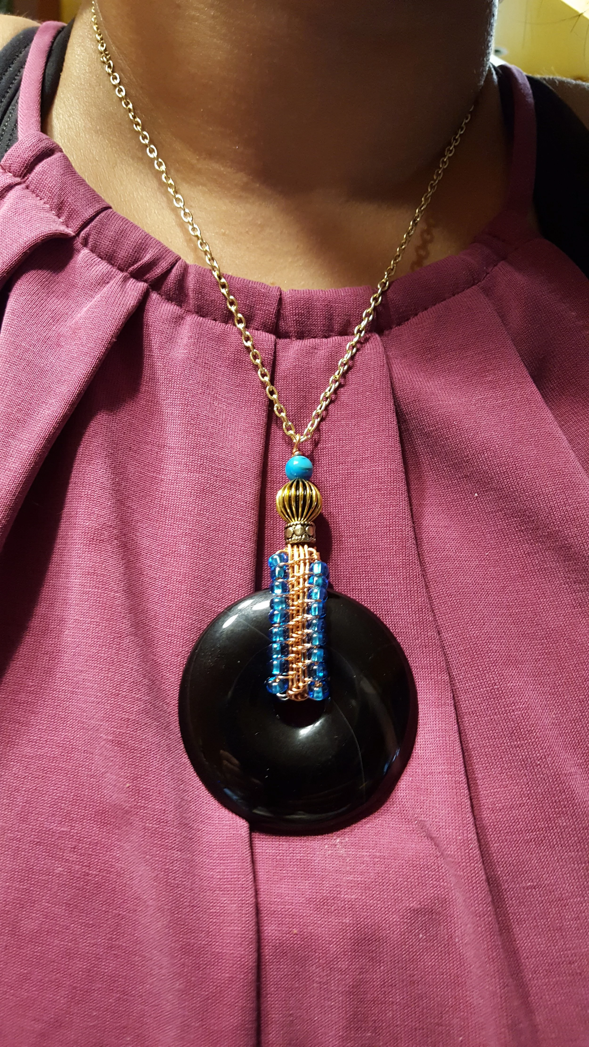 Pendant wirewrapped in copper around Onix stone.jpg