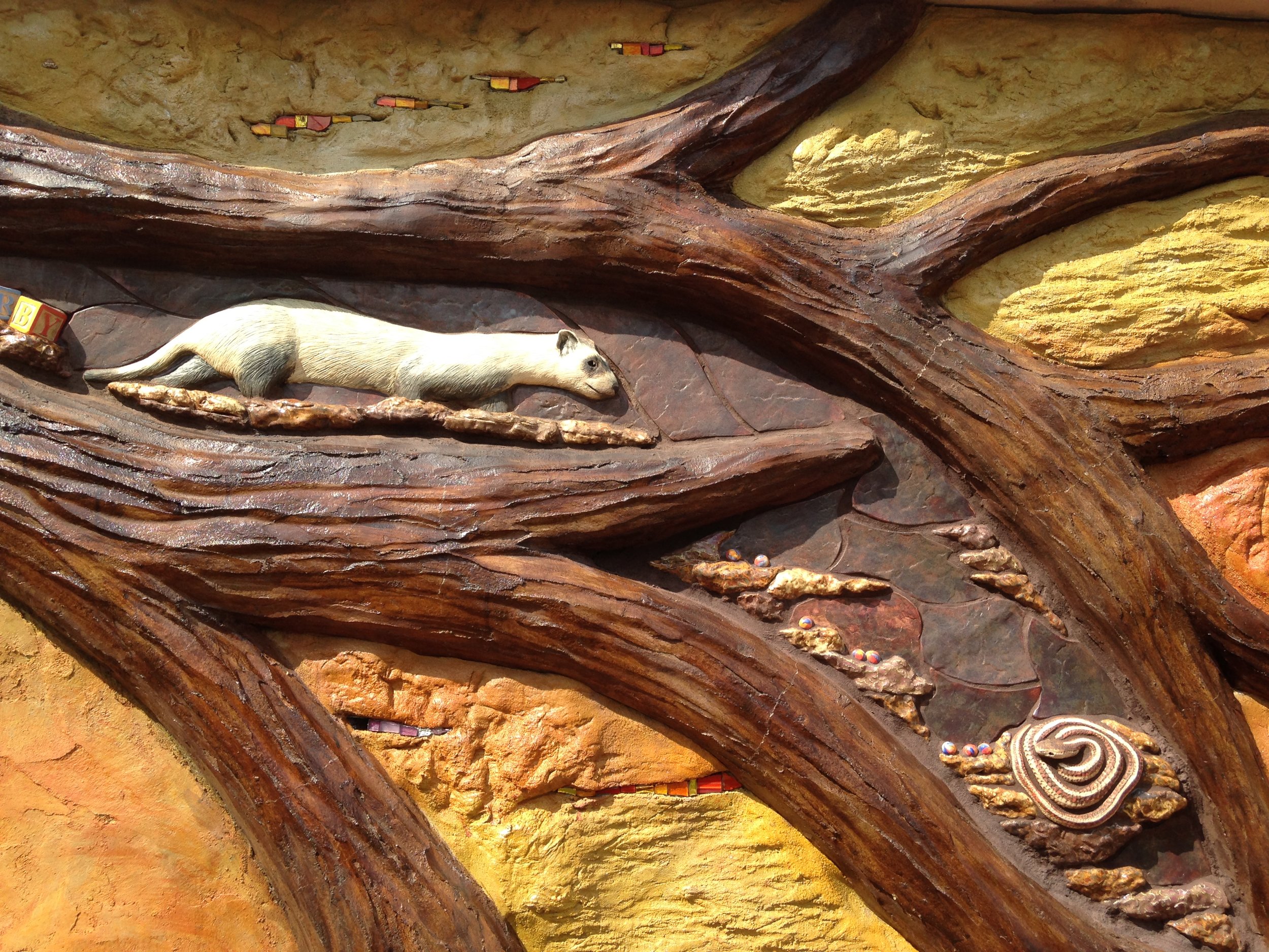  Black footed ferret and garter snake - Sculpted and glazed ceramic tile. Sculpted and stained concrete. Glass tile mosaic. - 2016 