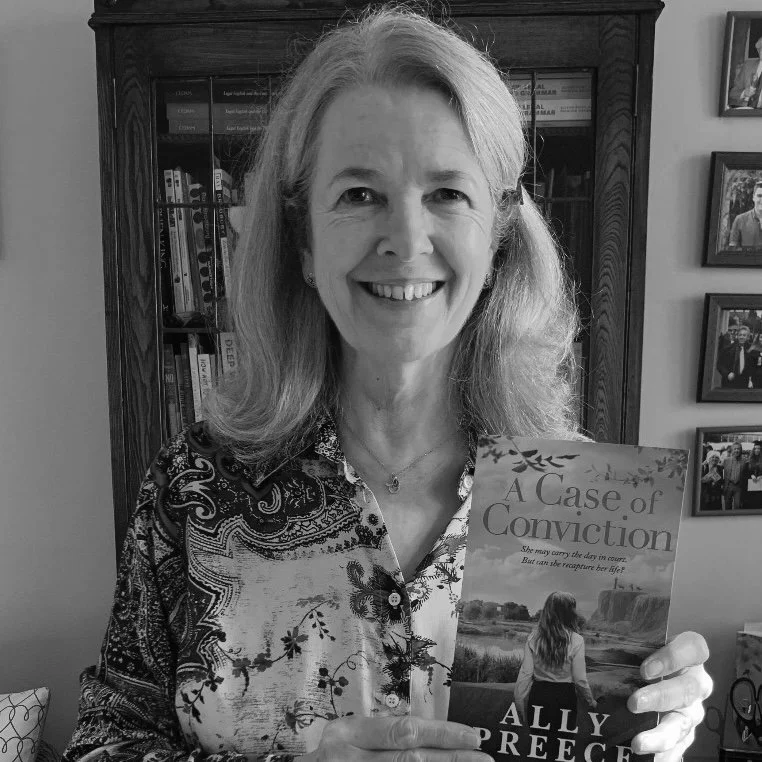 Ally Preece holding her debut novel A Case of Conviction