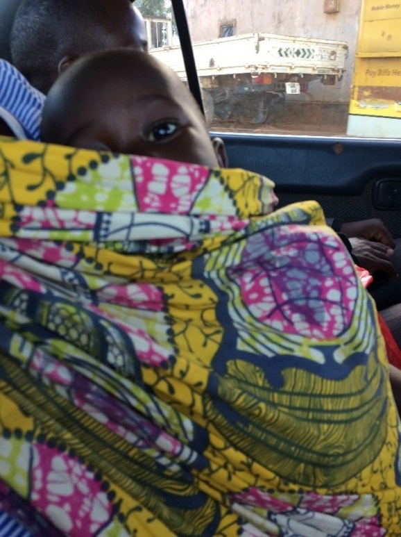 Timepo’s son peaking out from his chitenge wrap