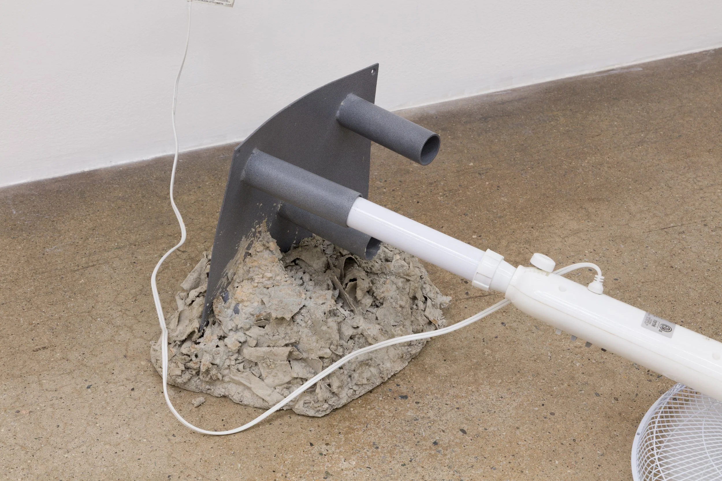  “Circulate I”  2025  Fan, Powder coat steel, cardboard, cement  47 x 27 x 14 inches 