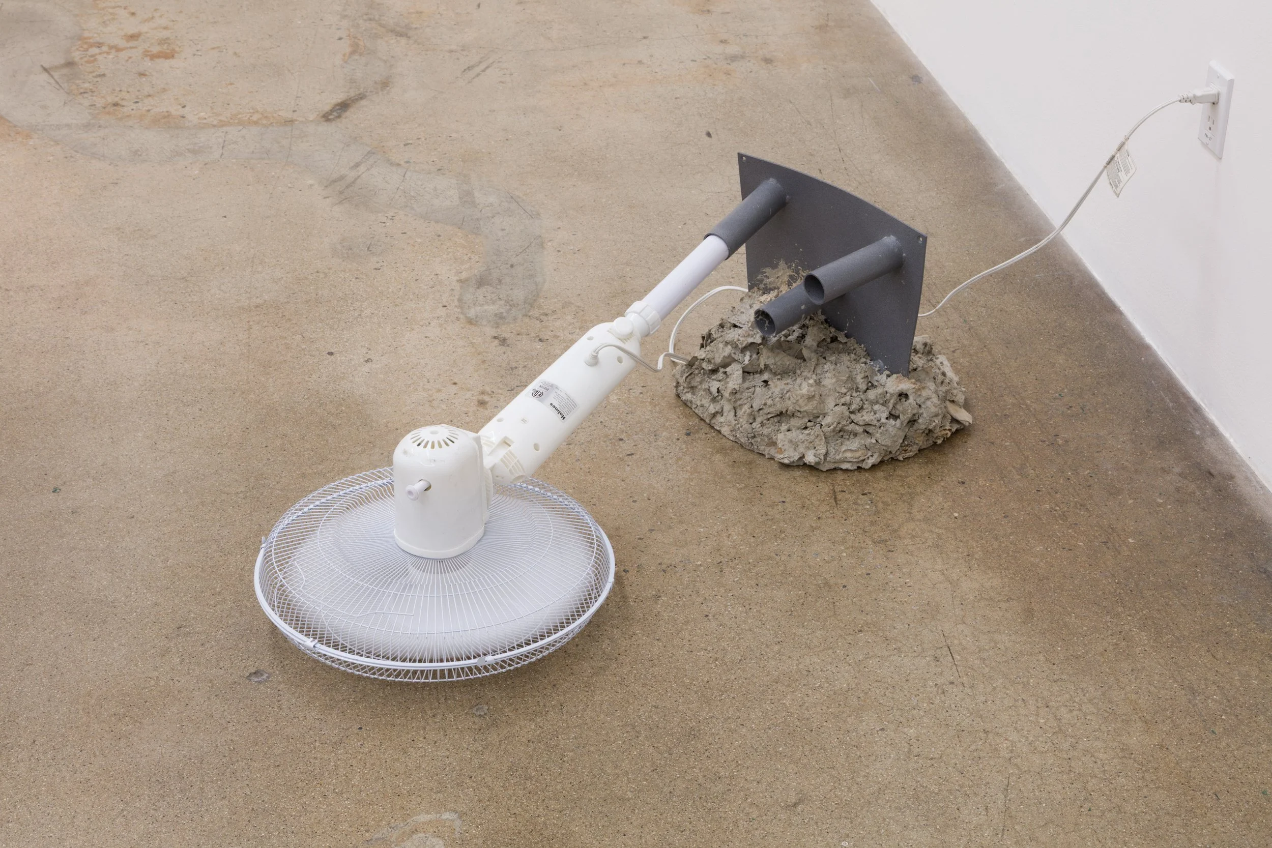  “Circulate I”  2025  Fan, Powder coat steel, cardboard, cement  47 x 27 x 14 inches 