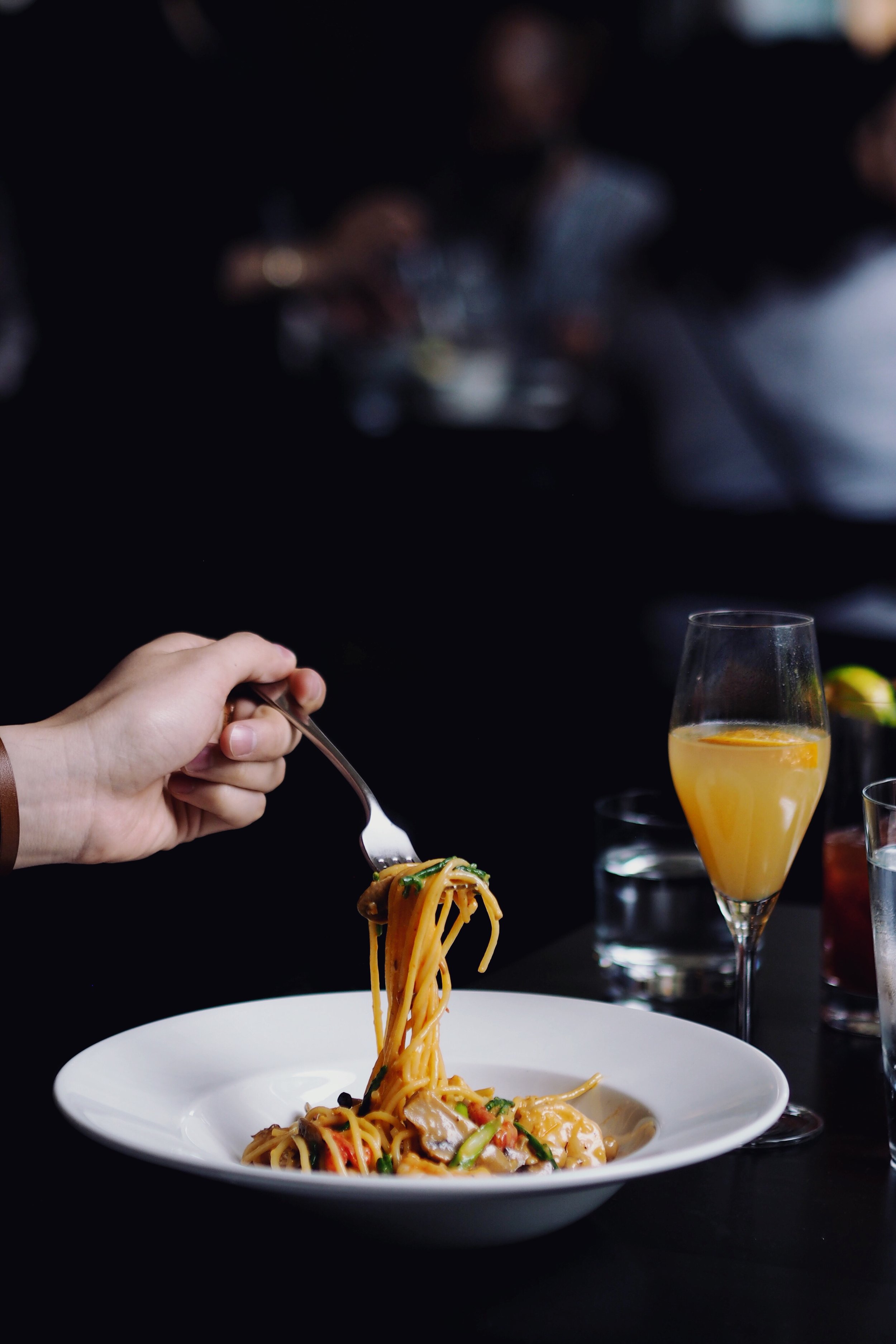Michael ( @globalgarcon ) digging into Fresh Linguini with Shrimp and Scallops finished a Rosé Sauce 