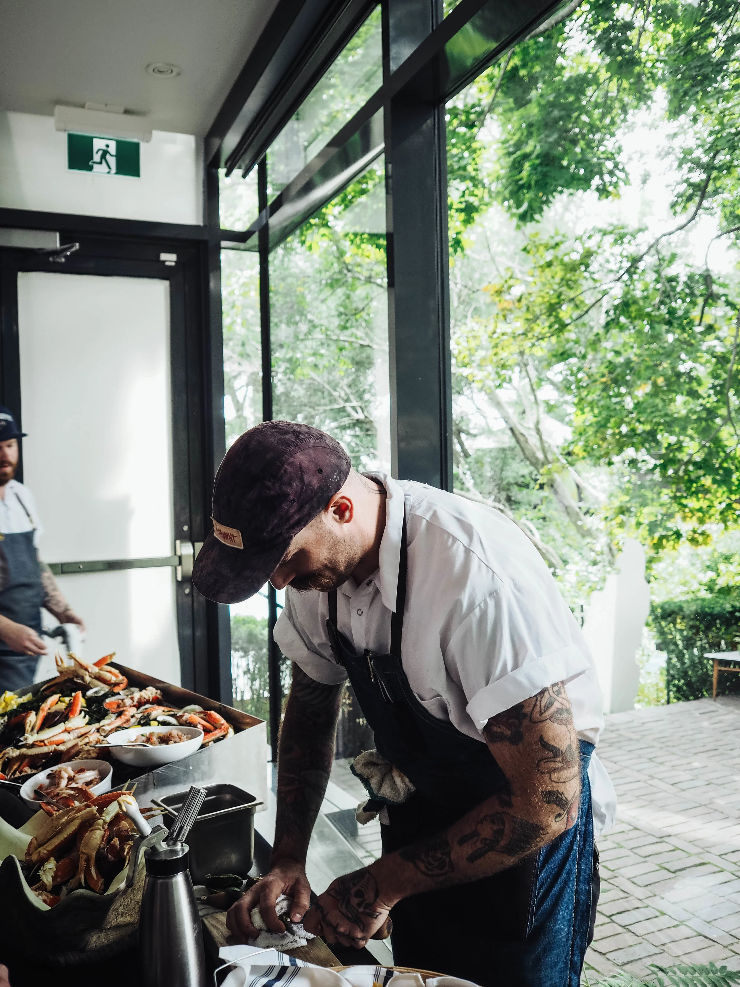 Chef shucking fresh oysters. 