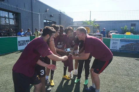Futsal Society Raising Trophy.JPG