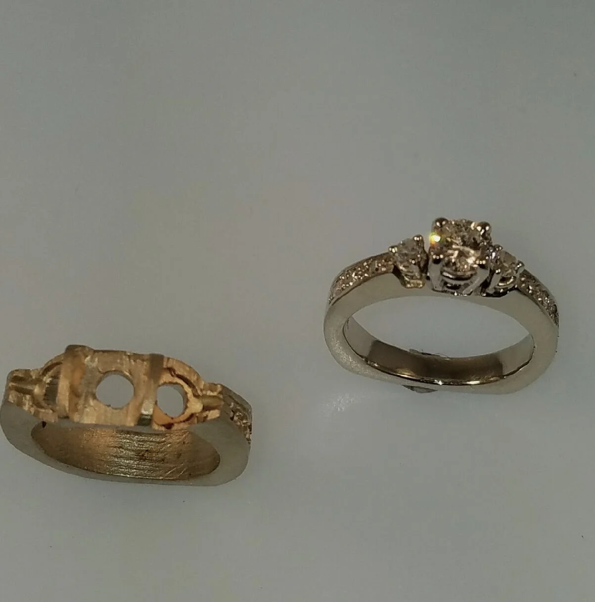 The raw casting on the left will be ring number 2. We are in the process of having old diamonds re-cut, and will unveil the final product closer to the Holidays. Stay tuned!