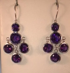 Sterling silver and amethyst dangle earrings. $675