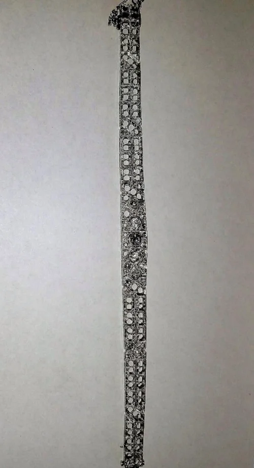 1920's art deco platinum bracelet prior to setting in stones. Some diamonds are sitting atop of bracelet, as this photo was taken while we were working on tracking down all of the stones. 