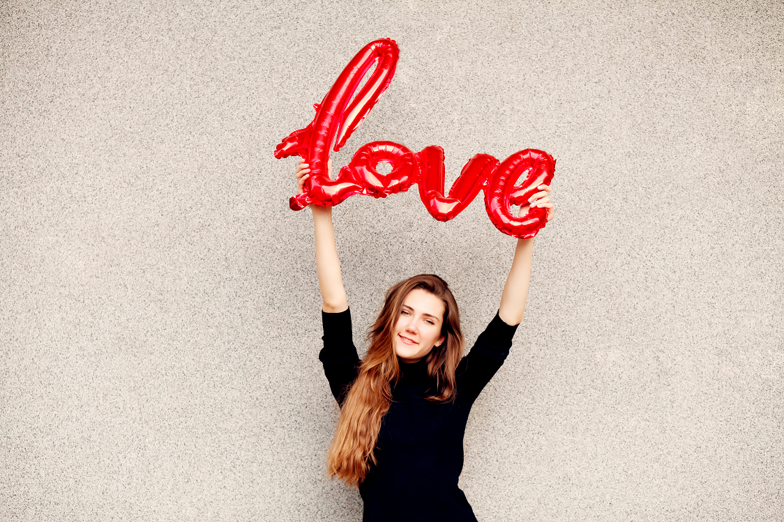 Canva - Woman Holding Love Sign 3.png