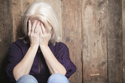 incontinence-menopause-head-in-hands.jpg
