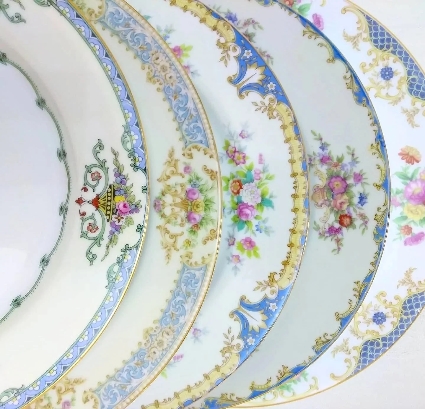 Beautiful vintage mismatched blue ornate floral plate collection for rent from Delicate Dishes LLC