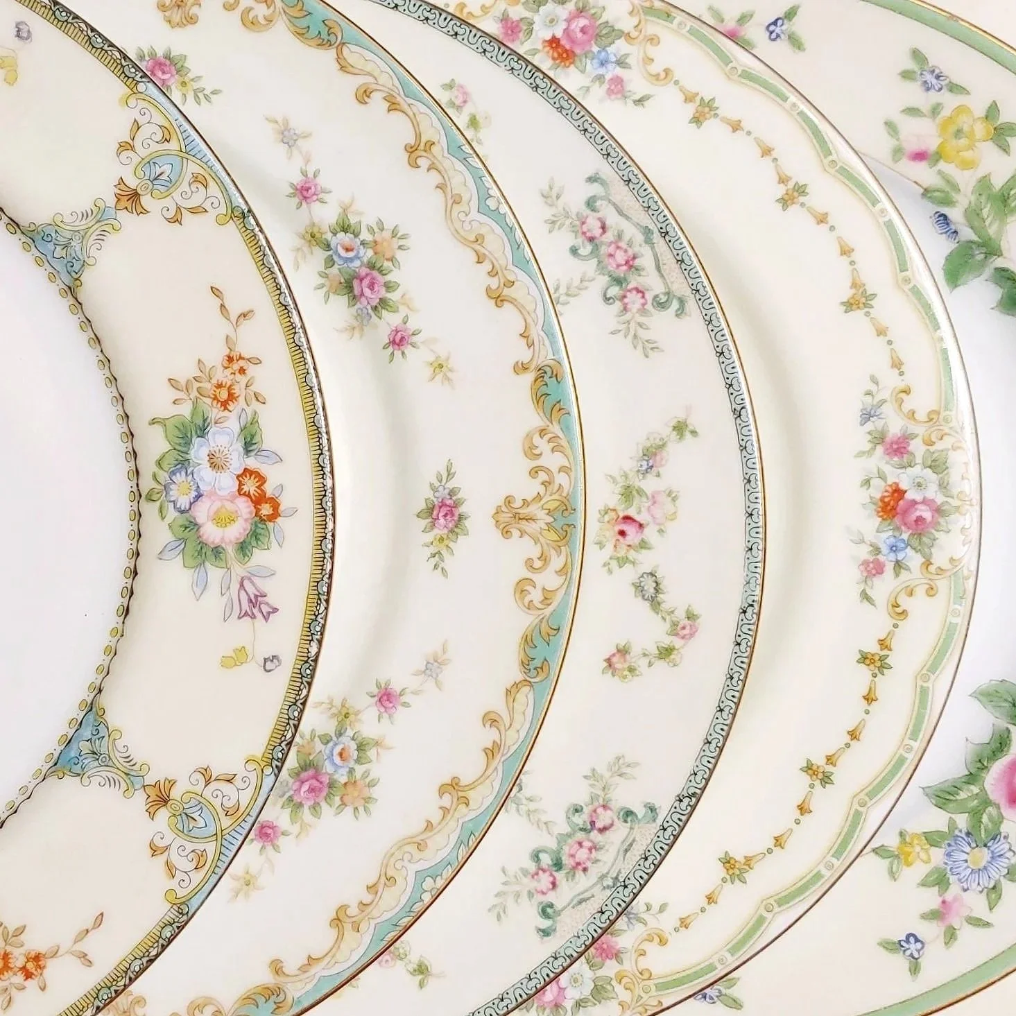 Beautiful vintage mismatched green ornate floral plate collection for rent from Delicate Dishes LLC
