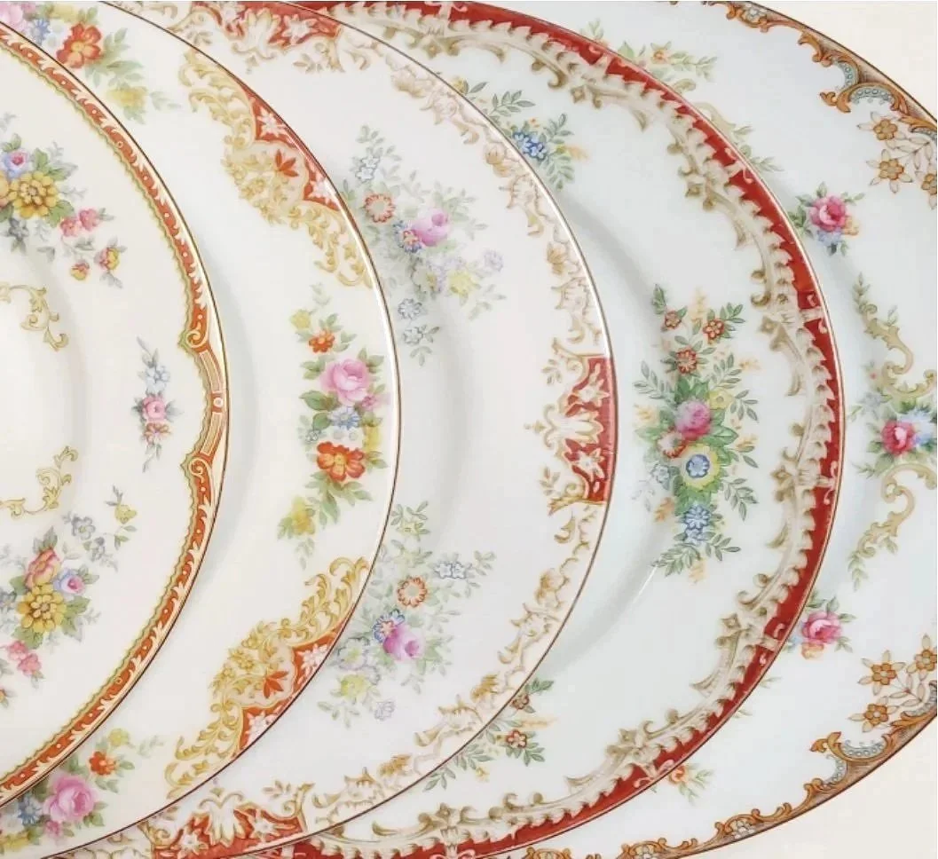 Beautiful vintage mismatched red ornate floral plate collection for rent from Delicate Dishes LLC