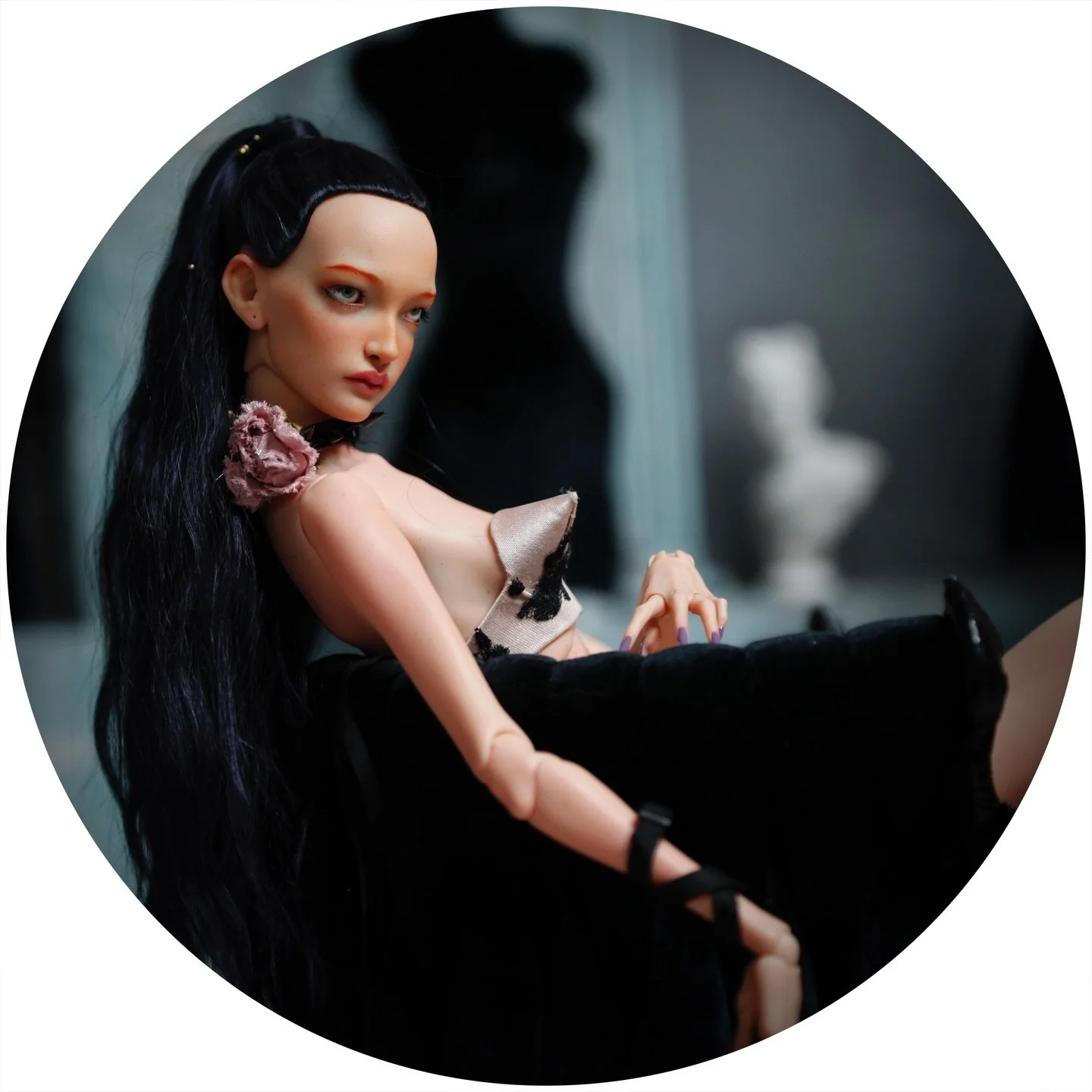 Poised between shadow and silk, she bends&mdash;but never breaks.

She carries herself like a living contradiction&mdash;soft porcelain beauty tempered by a will that has learned to survive shadowed rooms and unspoken rules. Quietly observant and sel