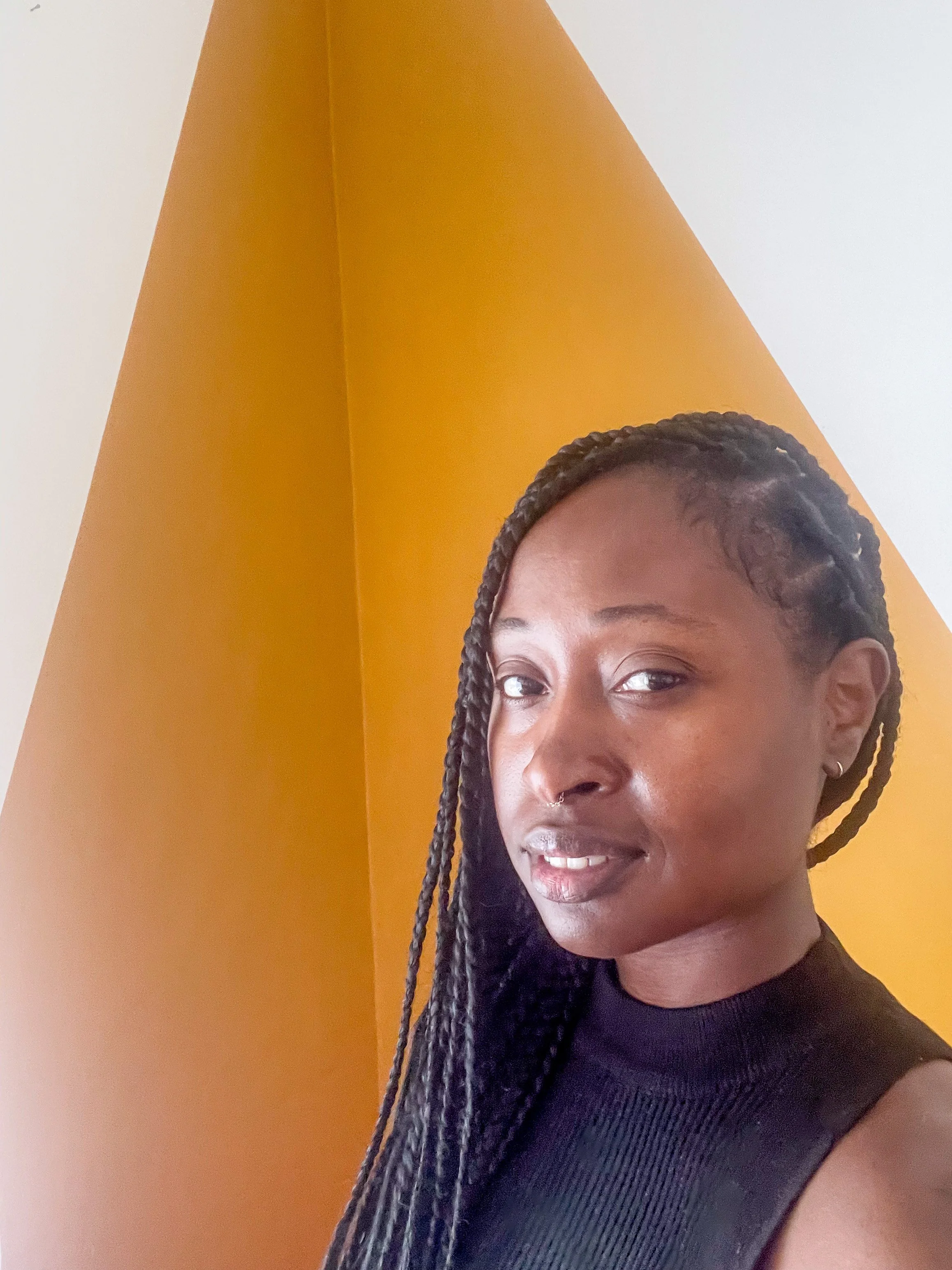 woman with braids smiling