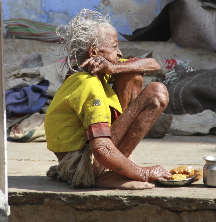 This was taken with a telescopic lens I was too embarrassed to be seen taking this image as I felt that I was imposing on her. India in the raw. 
