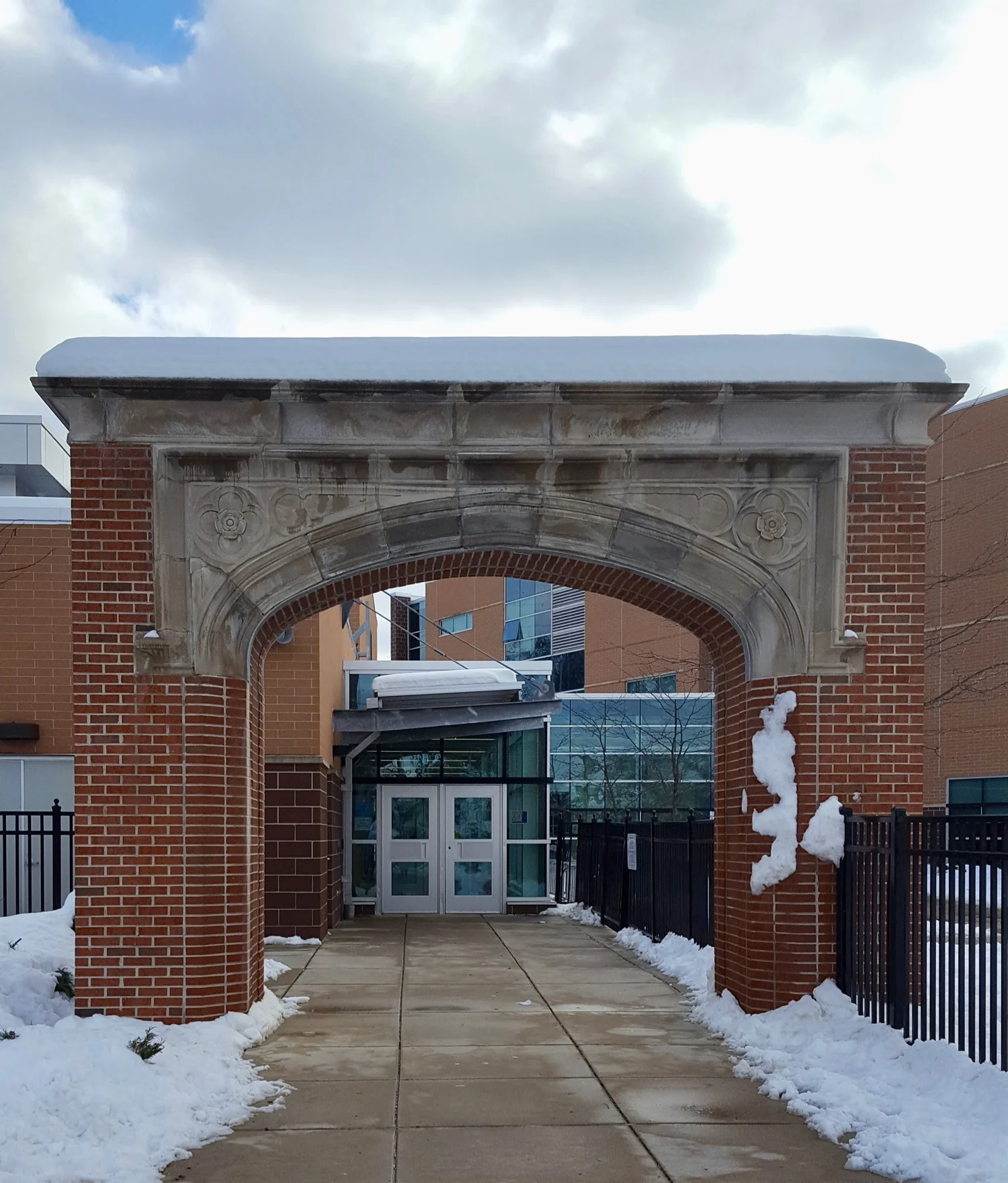 ORIGINAL ARCH IS ALL THAT REMAINS OF THE OLD MODIFIED GOTHIC STYLE . DICKINSON SCHOOL WAS REPLACED BY A NEW BUILDING.